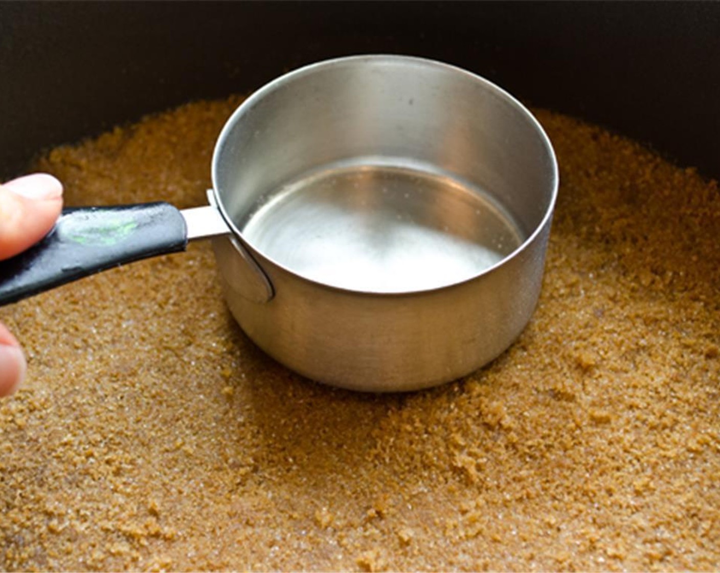 step 3 Dump the moistened crumbs into the prepared pan and press into an even layer.