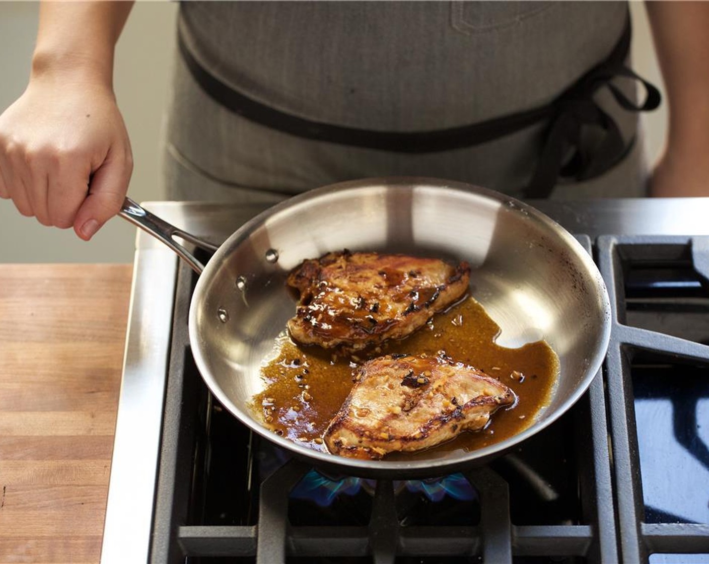 step 20 Add Extra-Virgin Olive Oil (1 Tbsp) to a medium saute pan over medium heat. When the oil is hot, add the chicken breast and cook for three minutes on each side or until cooked through.