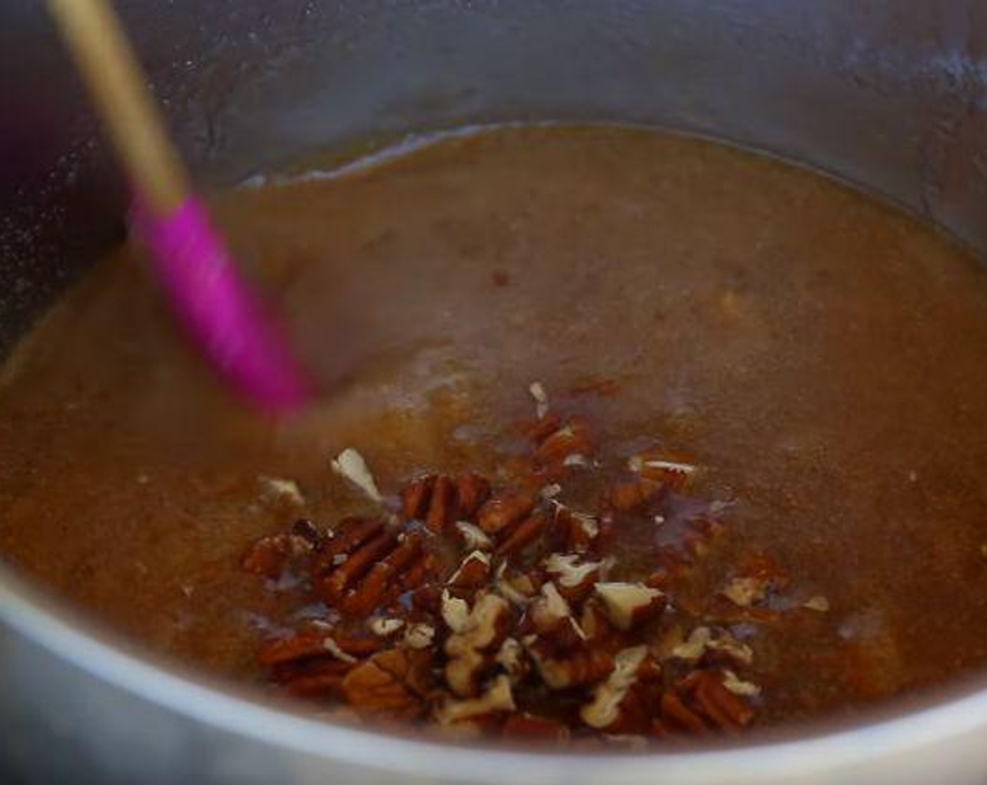 step 4 In a heavy bottomed sauce pan over medium heat, pour Butter (1 cup), Heavy Cream (1 cup), and Brown Sugar (1 cup) and bring to a boil. Reduce heat to low, stir in the Roasted Pecans (1/2 cup) and simmer until the sauce thickens, 5 minutes.