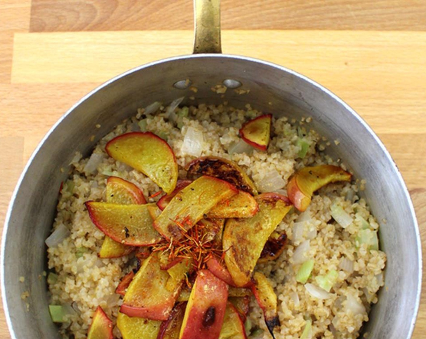 step 9 Add fruit and juice from Lemon (1) to the bulgur mixture. Taste and adjust seasoning with Saffron Threads (1 pinch), Fresh Ginger (1 pinch), and Cayenne Pepper (1 pinch).