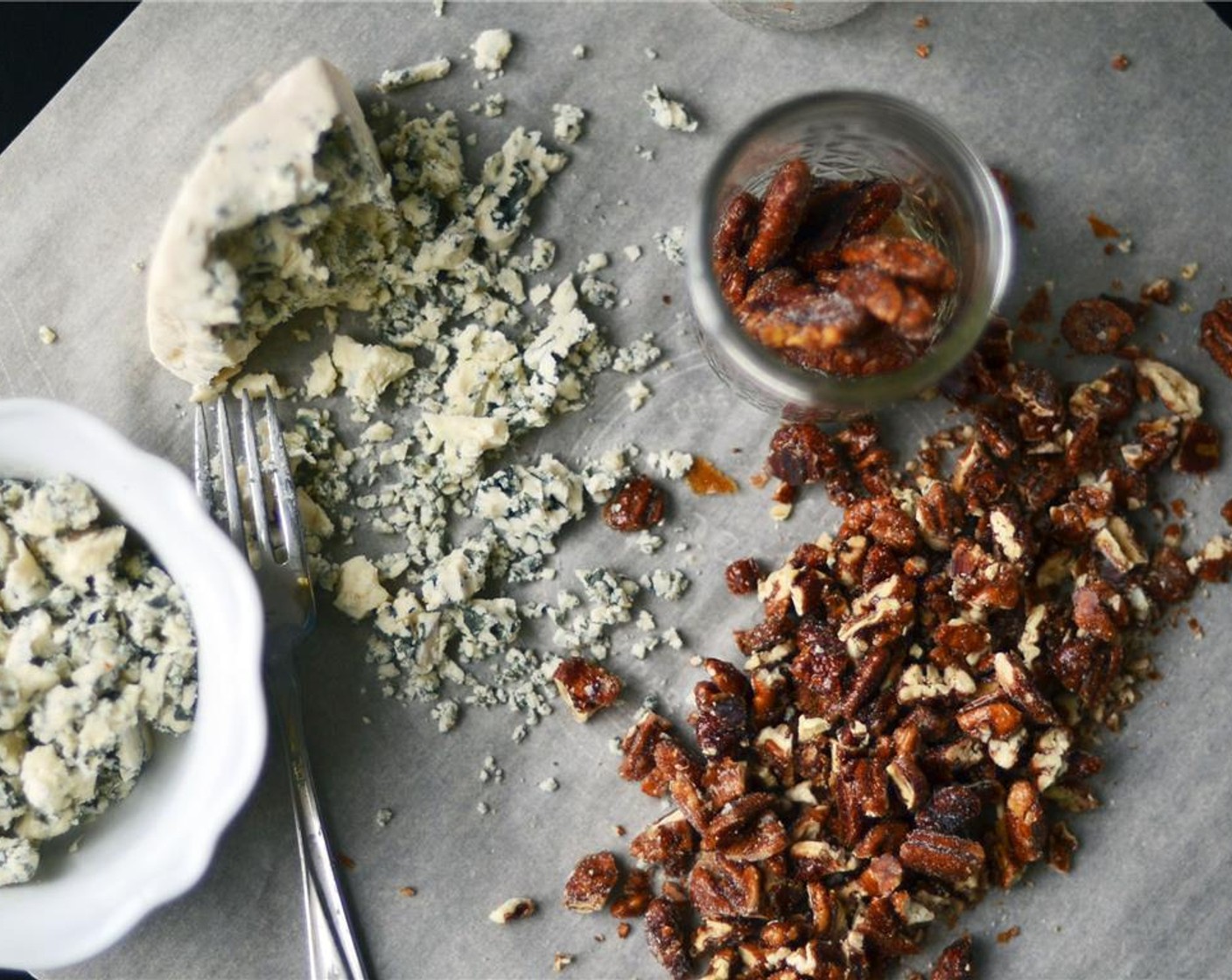 step 2 Using a fork, break Blue Cheese (3/4 cup) into medium-ish crumbles and roughly chop Honey Roasted Pecans (1 cup). Set aside.