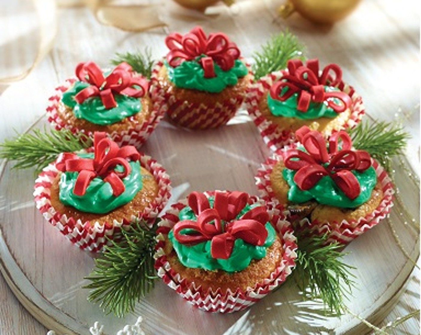 step 5 Frost the cupcakes; decorate with red fondant bows if desired.