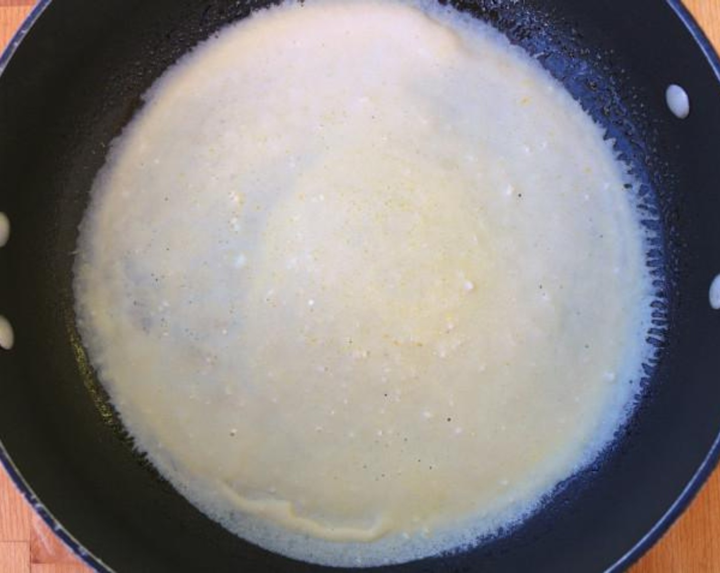 step 4 In a medium-hot, lightly buttered pan, spread the batter thin and evenly, cook until lightly browned, flip to other side.