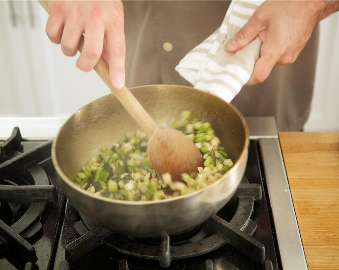 step 13 Add one tablespoon of olive oil to the same saute pan and heat over medium high heat. Add the onion, celery, pasilla pepper, and garlic to the pan. Stirring often, cook for five minutes until they caramelize.