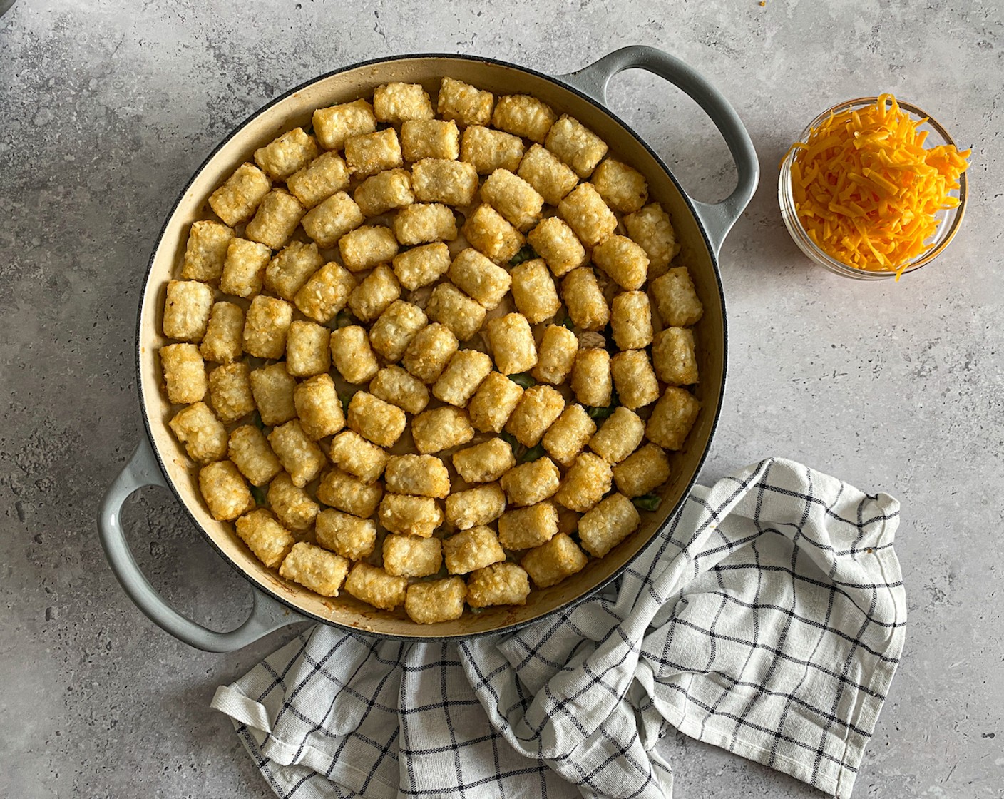 step 7 Arrange the Frozen Tater Tots (6 3/4 cups) onto the chicken mixture until completely covered.