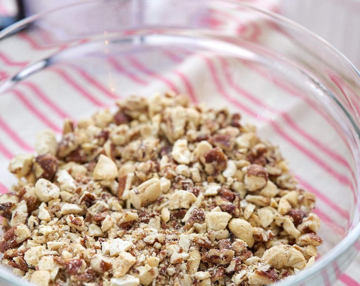 step 3 In a separate bowl make the topping. Combine the Assorted Nuts (2 cups), Ground Cinnamon (1 tsp), Ground Nutmeg (1/2 tsp), Coconut Sugar (2 Tbsp), and Butter (2 Tbsp).