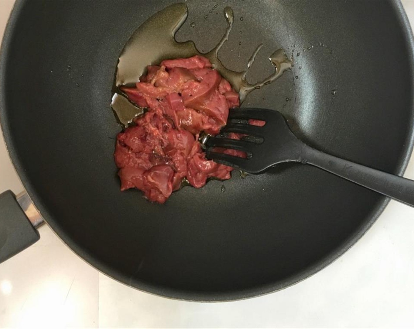 step 1 Chop the chicken livers up into small bits. Pour a little Vegetable Oil (as needed) into a large wok or non-stick pan and place it over medium-high heat. Once the oil is hot, add the Chicken Livers (7 oz).