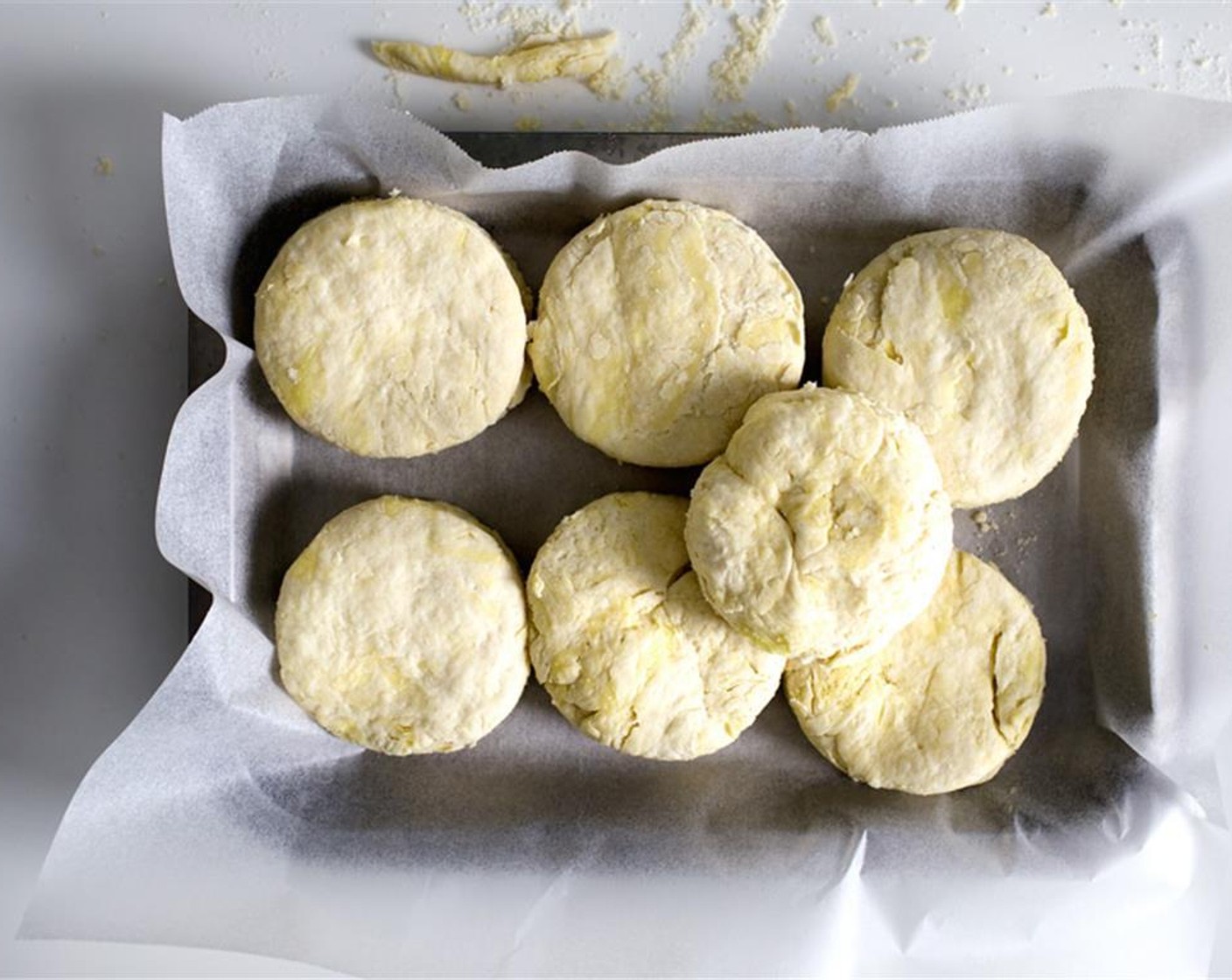 step 7 Cut out the as many biscuits you can with a round-cutter, gather the scraps, and cut again. You should have about 9~10 biscuits. Place the biscuits on a parchment-lined plate, and freeze for 2 hour until frozen. Can be made the day ahead.