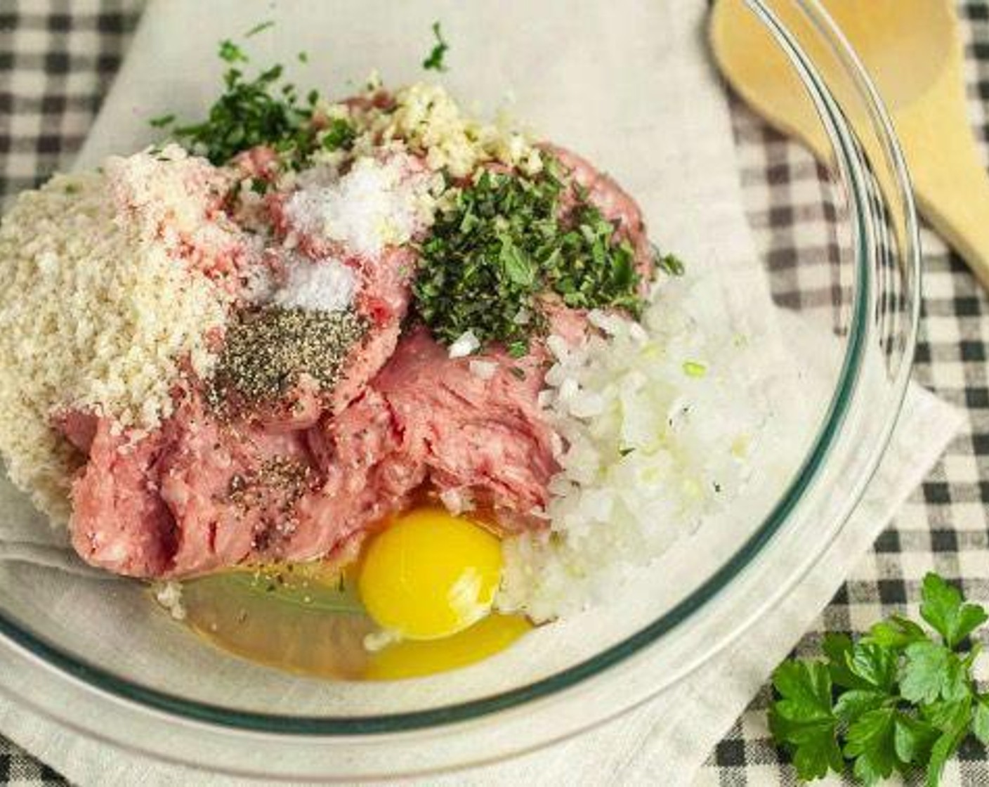 step 1 Add Ground Lamb (1 lb), Farmhouse Eggs® Large Brown Egg (1), Panko Breadcrumbs (4 Tbsp), White Onions (4 Tbsp), Fresh Oregano (1 Tbsp), Fresh Parsley (2 tsp), Garlic (2 cloves), Kosher Salt (1/2 tsp), and Ground Black Pepper (1/2 tsp) to a large bowl.