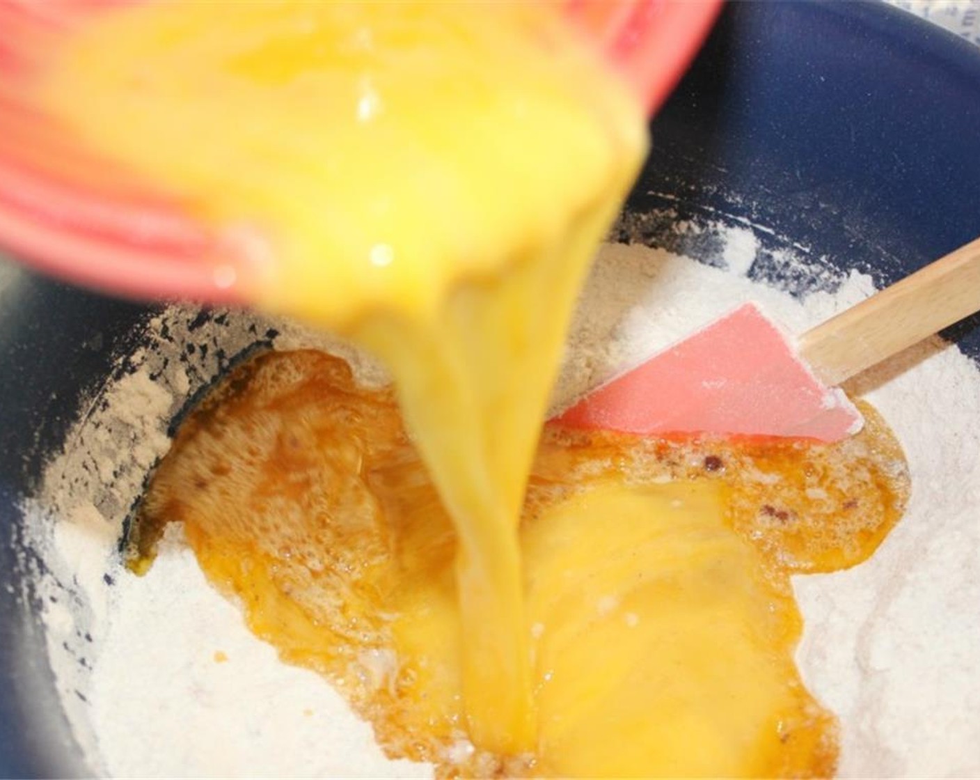 step 4 Whisk Eggland's Best Classic Eggs (4) and Vanilla Extract (1 Tbsp) then pour them into the dry ingredients and mix well to combine. Add the Carrots (3 cups) and gently fold them into the batter.