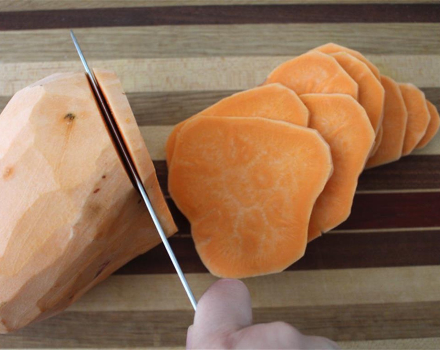 step 4 Cut the sweet potatoes into 1/4 inch slices.