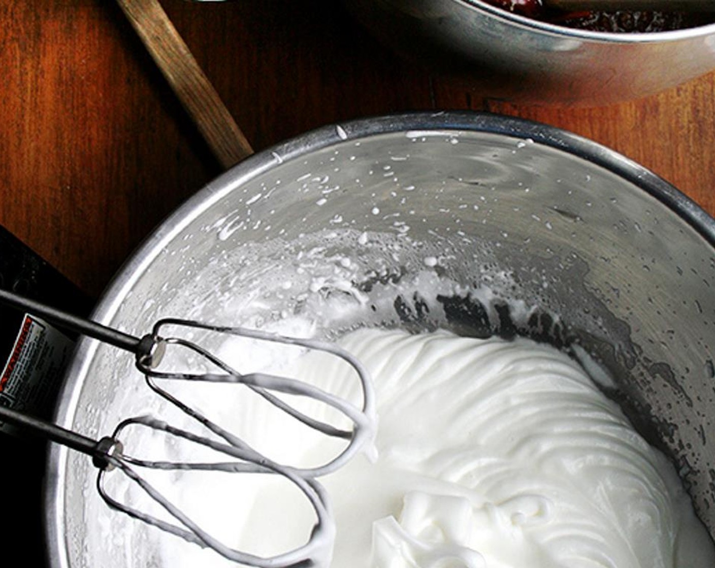 step 8 In a clean bowl, beat the Egg Whites with the remaining quarter cup of sugar until they form firm peaks. In two additions, fold the egg whites into the chocolate mixture.