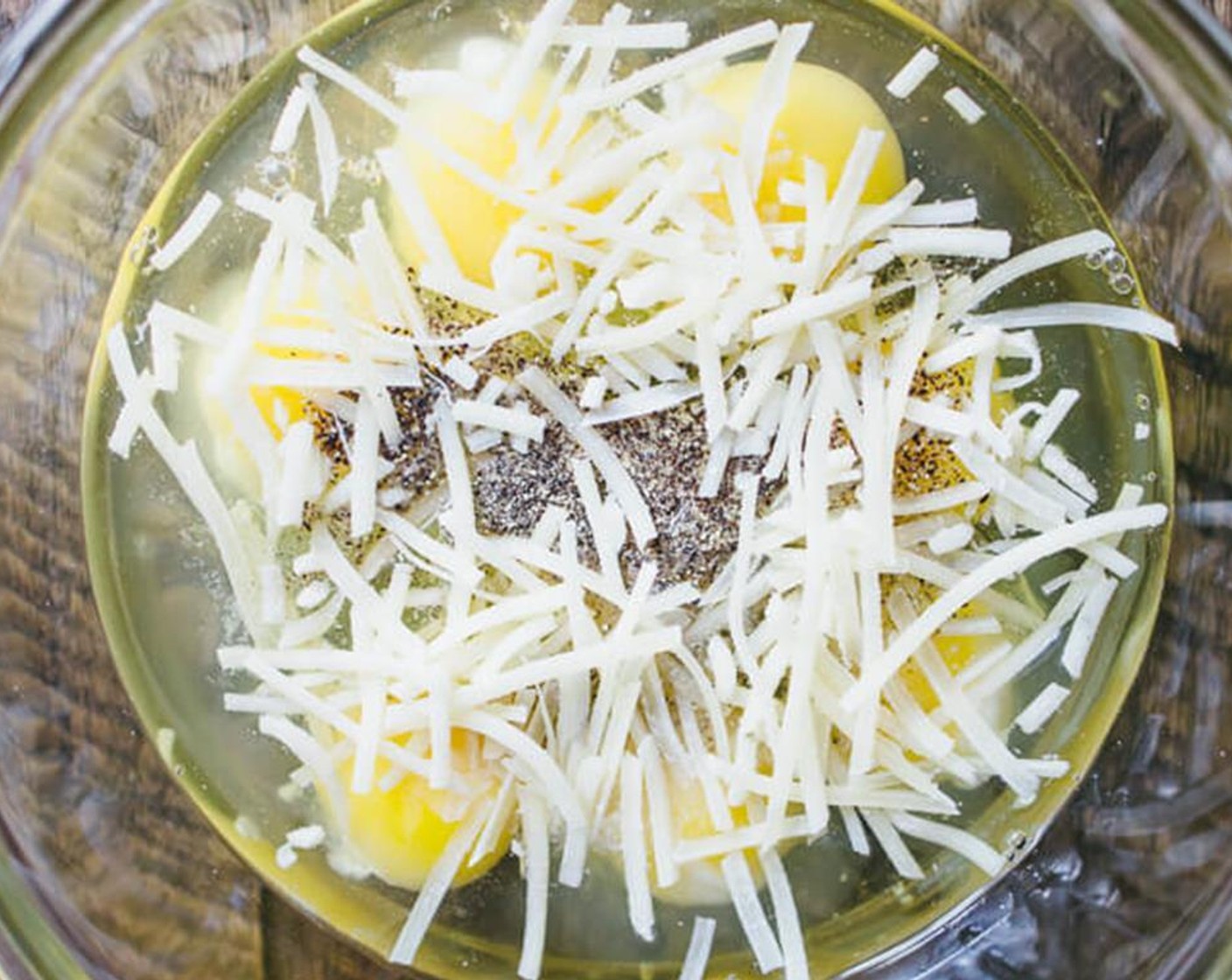 step 4 Whisk Farmhouse Eggs® Large Brown Eggs (8) in a large mixing bowl. Stir in Salt (1/2 tsp), Ground Black Pepper (1/4 tsp), Shredded Cheese (1/2 cup), and everything that was in the pan (broccoli, sweet potato, garlic, thyme).