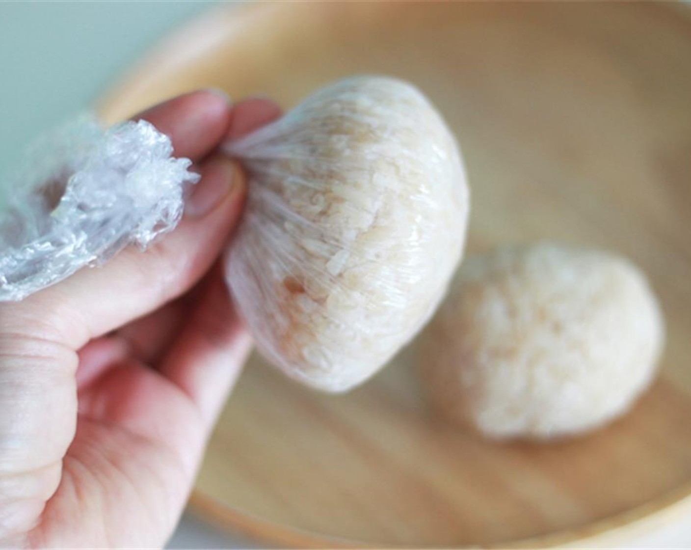step 4 Use plastic wrap to make rice balls. Your rice balls will be so much tighter than using your own hands. Then build the Rlakkuma body parts together.