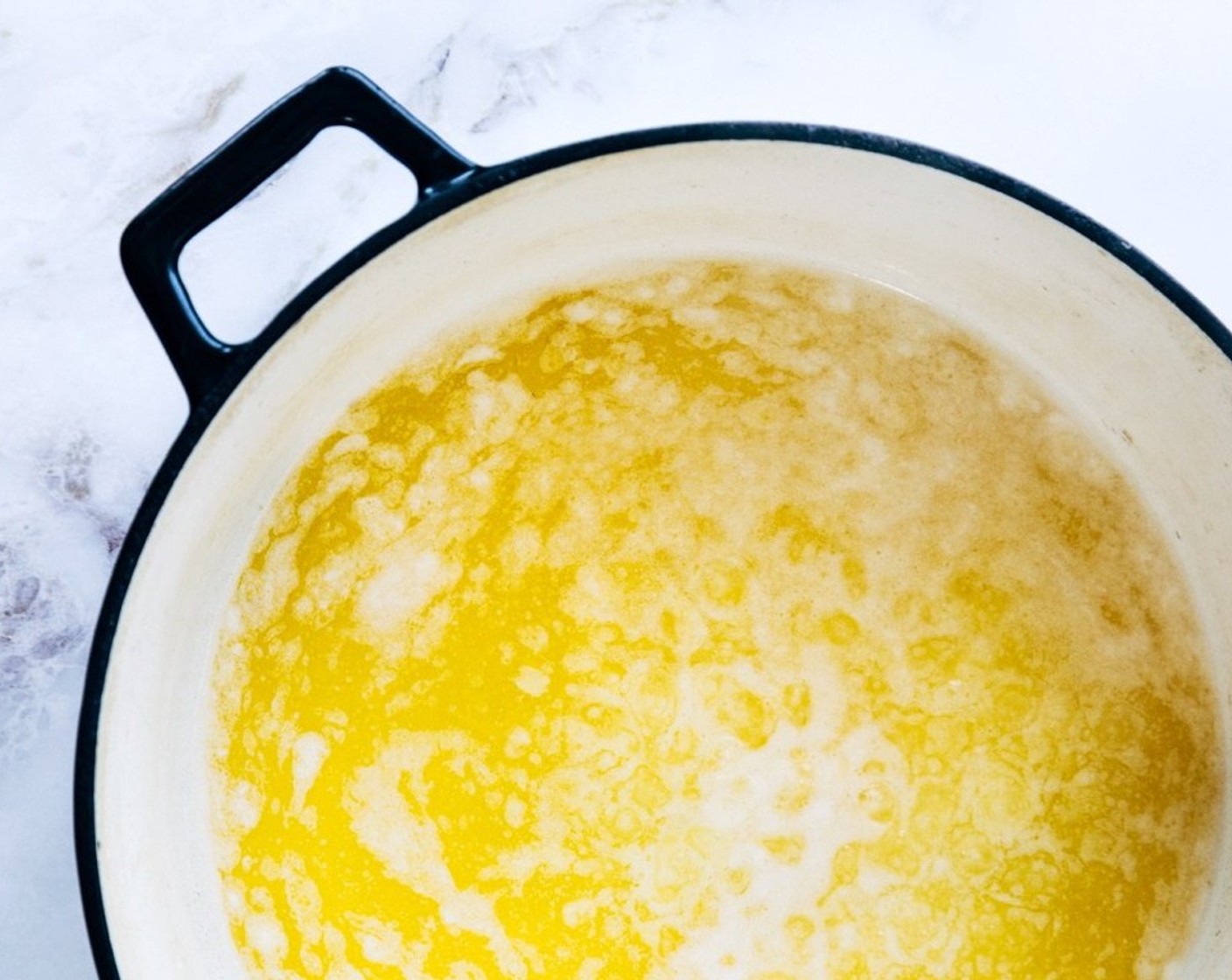 step 2 Swirl the pan occasionally to make sure that the butter is cooking evenly. As the butter melts, it will begin to foam, sputter and the coloring will get darker.