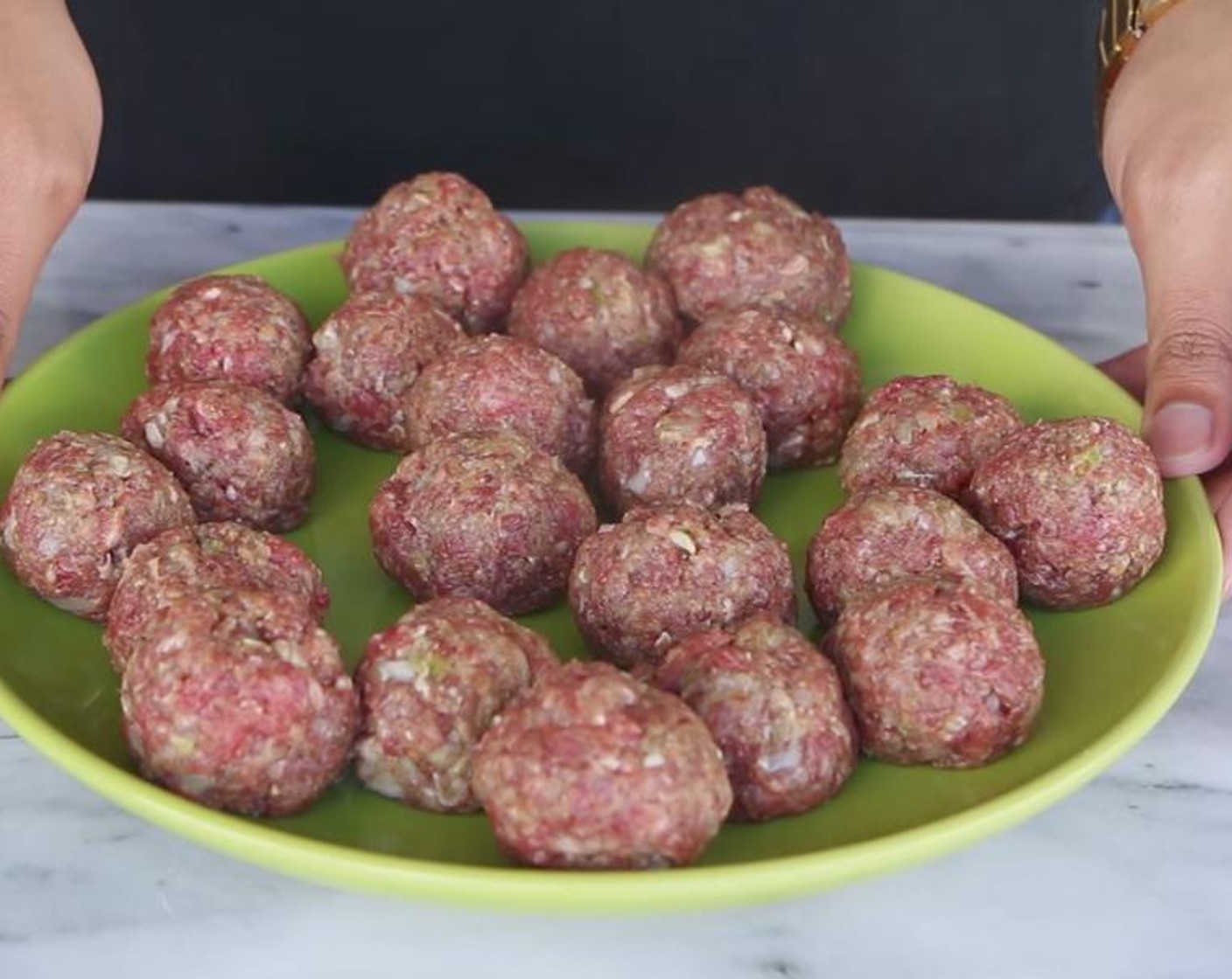 step 3 Use a cookie scoop to scoop out meat ball portions, roll them in your hands one by one before placing them onto a separate plate.