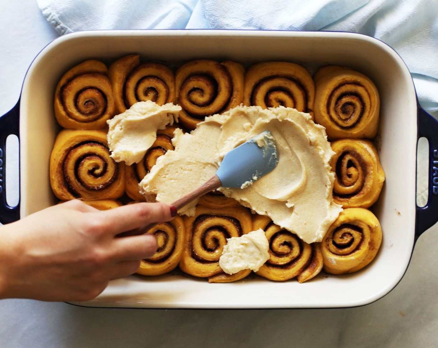 step 14 Mix the browned butter in a bowl with the Powdered Confectioners Sugar (3 cups) and Vanilla Extract (1/2 Tbsp) until smooth. Spread on top of the warm cinnamon rolls.