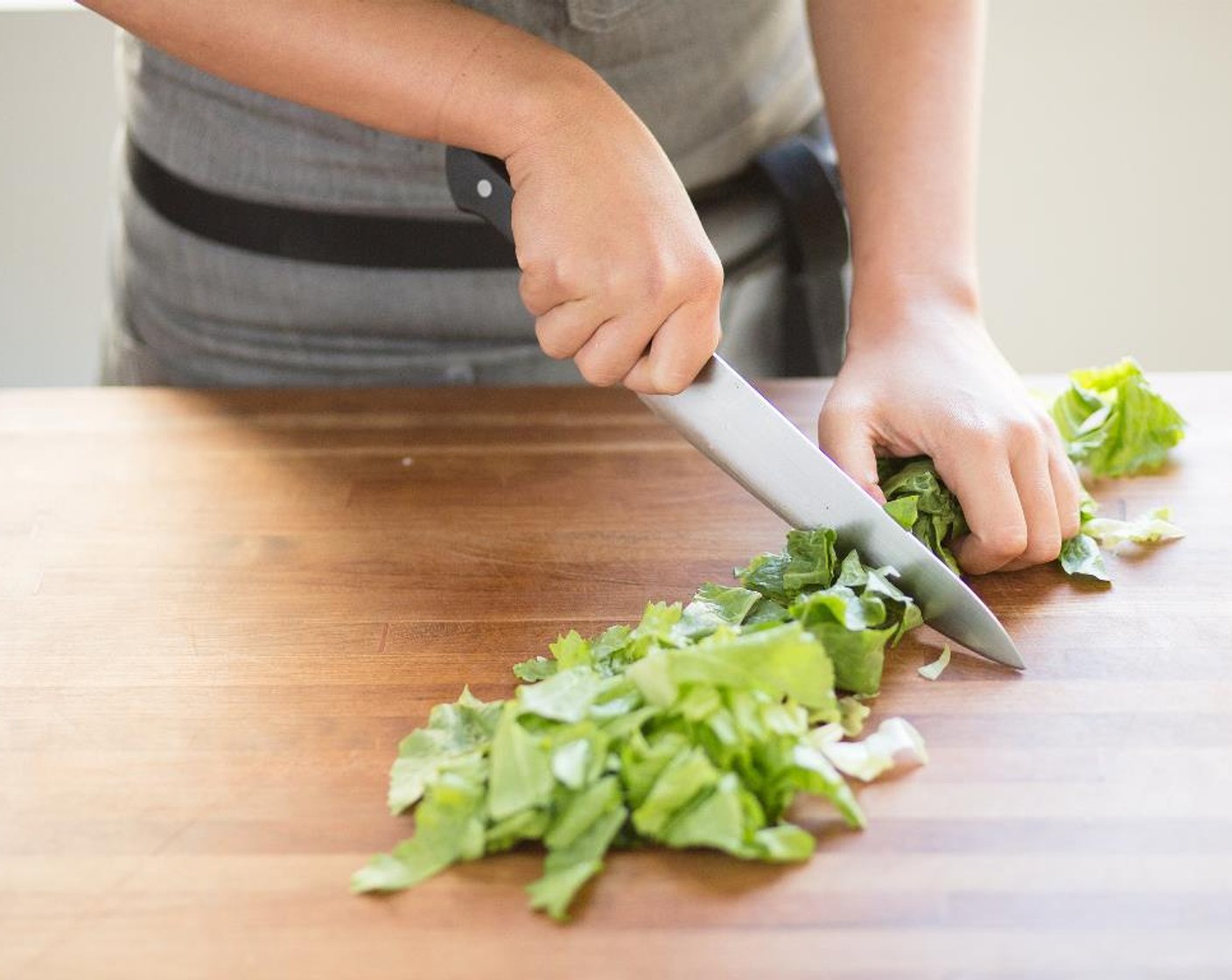 step 2 Cut Garlic (2 cloves) into 1/4 inch slices; set aside. Cut the Escarole Lettuce (8) leaves into 2-inch pieces; set aside.