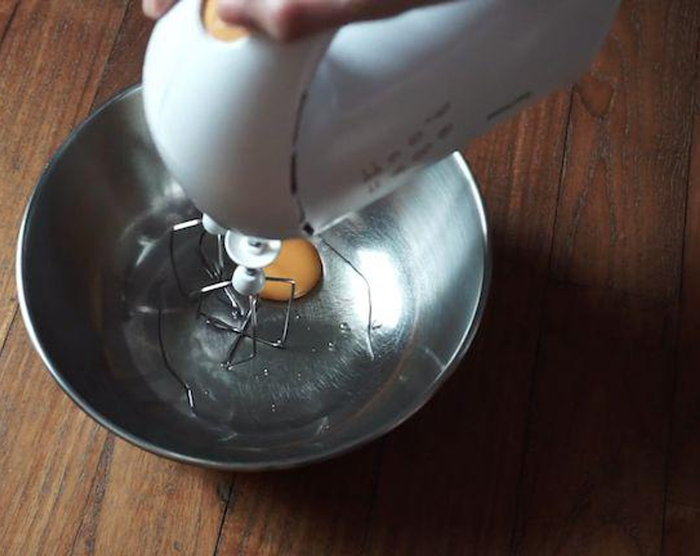 step 1 Beat the Egg (1) using an electric mixer, and add the Brown Sugar (2 Tbsp). Beat till it is white and fluffy.