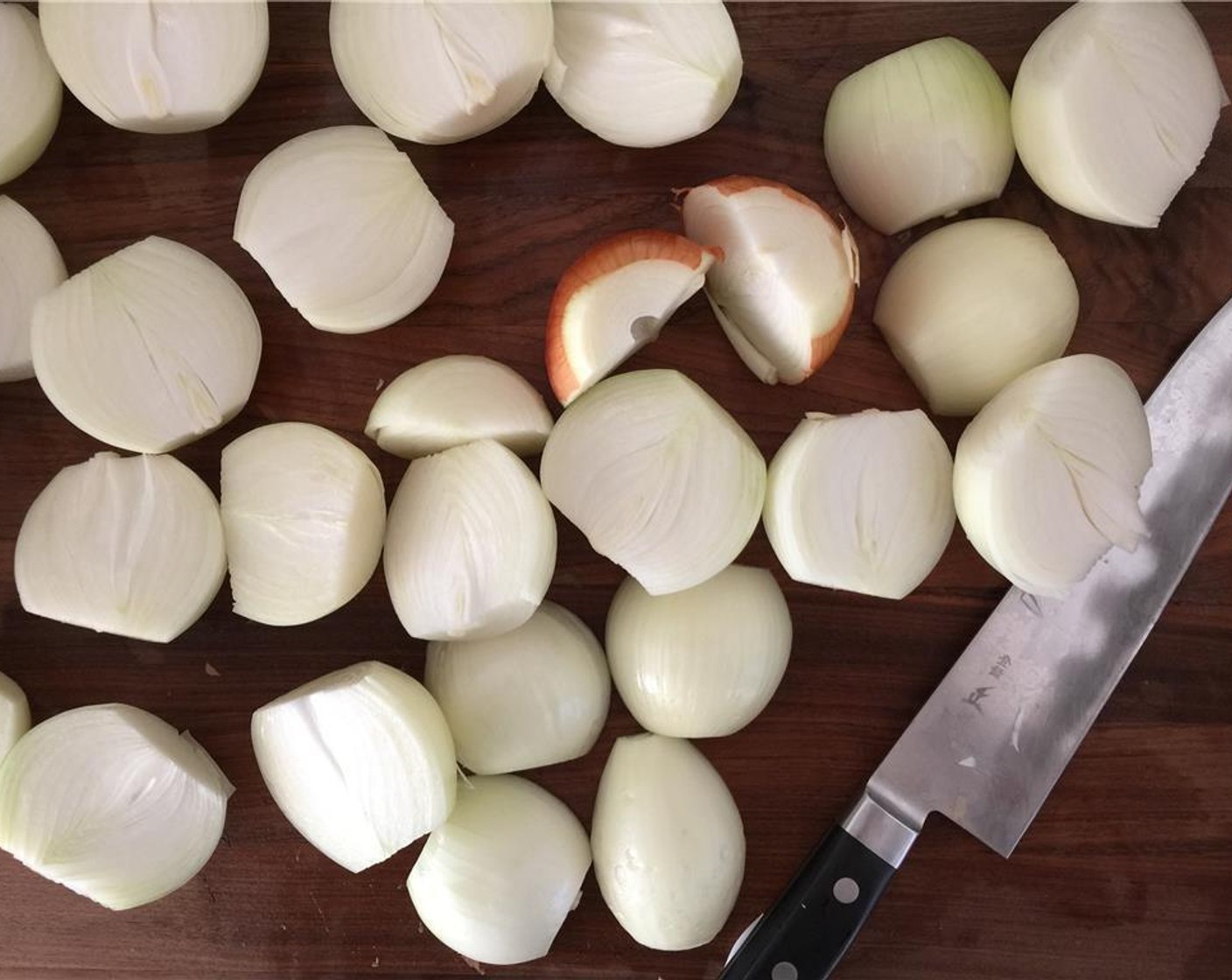 step 2 Halve and peel the onion.