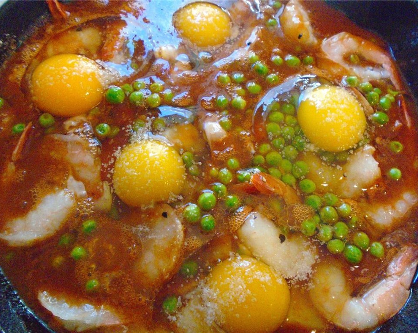 step 9 Add Eggland's Best Classic Eggs (5) and sprinkle eggs with Kosher Salt (to taste). Simmer slowly until eggs are cooked the way you like them. If you like your eggs more cooked than I do, put them under the broiler for a couple of minutes.