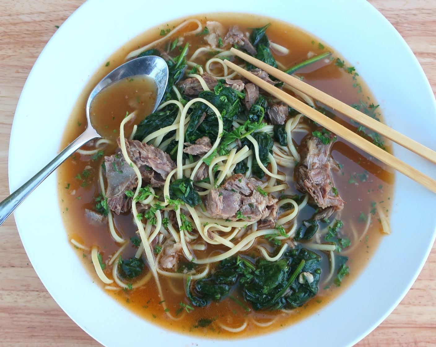 step 7 To serve, add 1/2 of the pasta, spinach and beef to each of two large soup plates. Add beef broth. Enjoy!