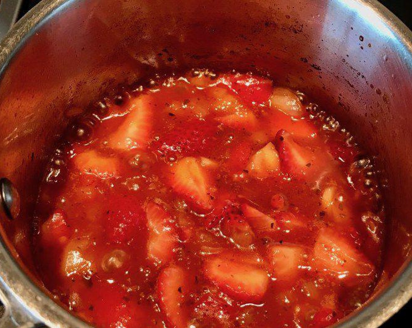 step 7 Add in Fresh Strawberries (2 cups), stir and bring to a boil. Once you’ve reached a boil, reduce heat to simmer and simmer for 10 to15 minutes, stirring every minute or so. Your strawberries should boil down, but you may wish to use a masher or immersion blender to achieve desired consistency. Remove from heat before doing so!