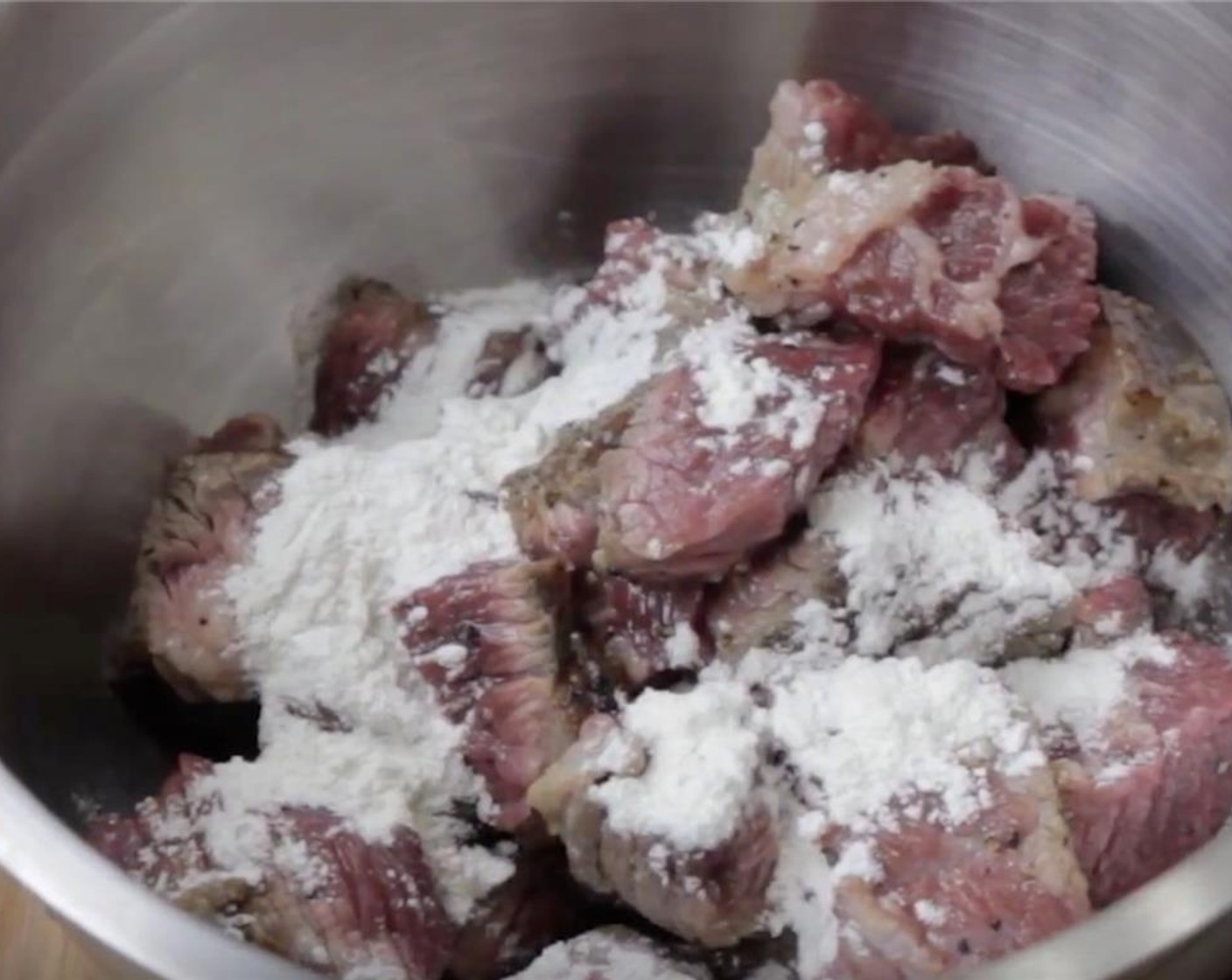 step 9 Cut the brisket into 1 to 1 1/2 inch cubes, then toss with All-Purpose Flour (1 Tbsp).