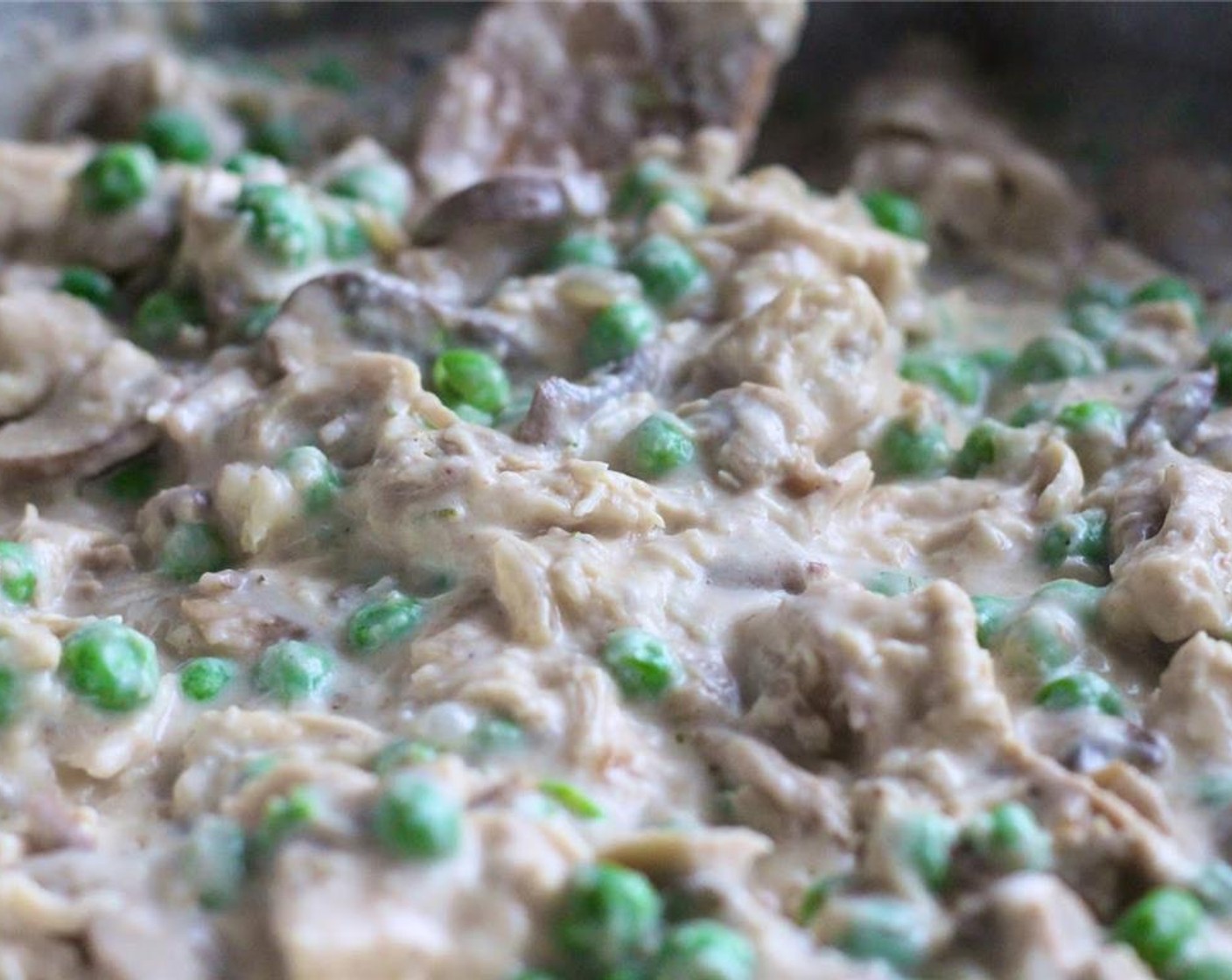 step 10 Add Chicken (2 cups), Frozen Green Peas (1 1/4 cups) and half of the Parmesan Cheese (1/3 cup), stir well.