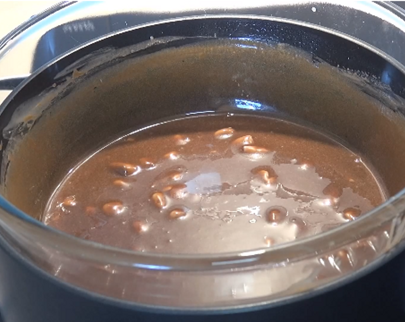 step 2 When the bars are completely melted and mixed with the cream, turn off the heat, carefully remove bowl from saucepan and let cool for 10 - 15 minutes.