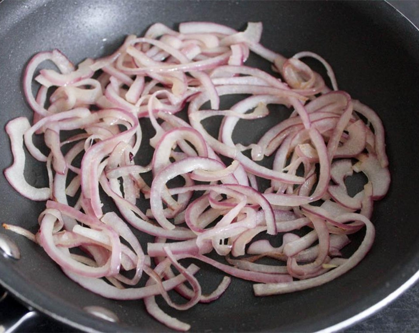 step 1 Heat 1 tsp of Oilve Oil in a small pan. When hot, add the Red Onion (1/2) and sauté for about 5 minutes until soft. Remove from the heat and set aside.