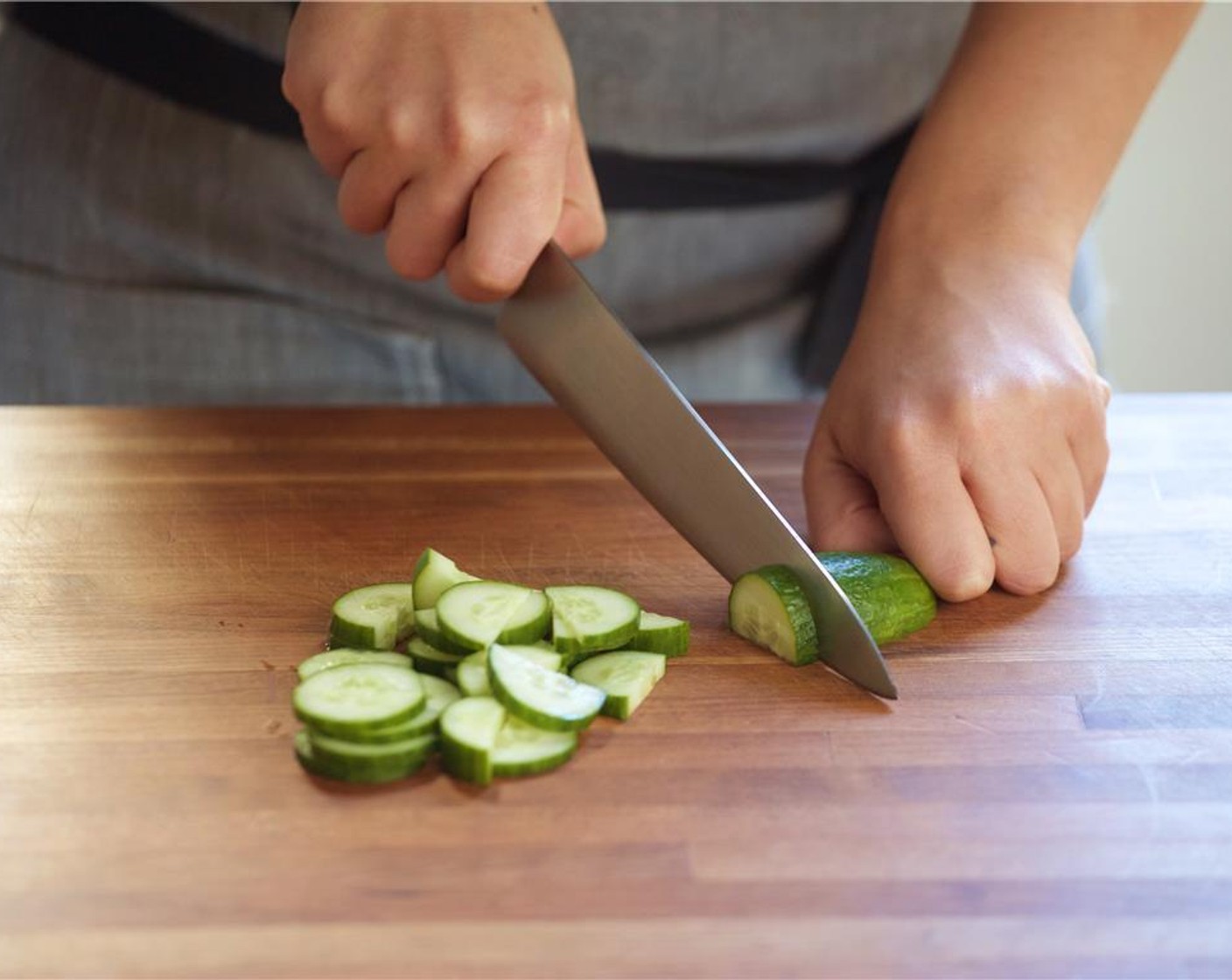 step 1 Slice Mini Cucumber (2) in half lengthwise, then into half inch pieces. Place in a medium bowl with Salt (1/4 tsp). Mix and set aside.