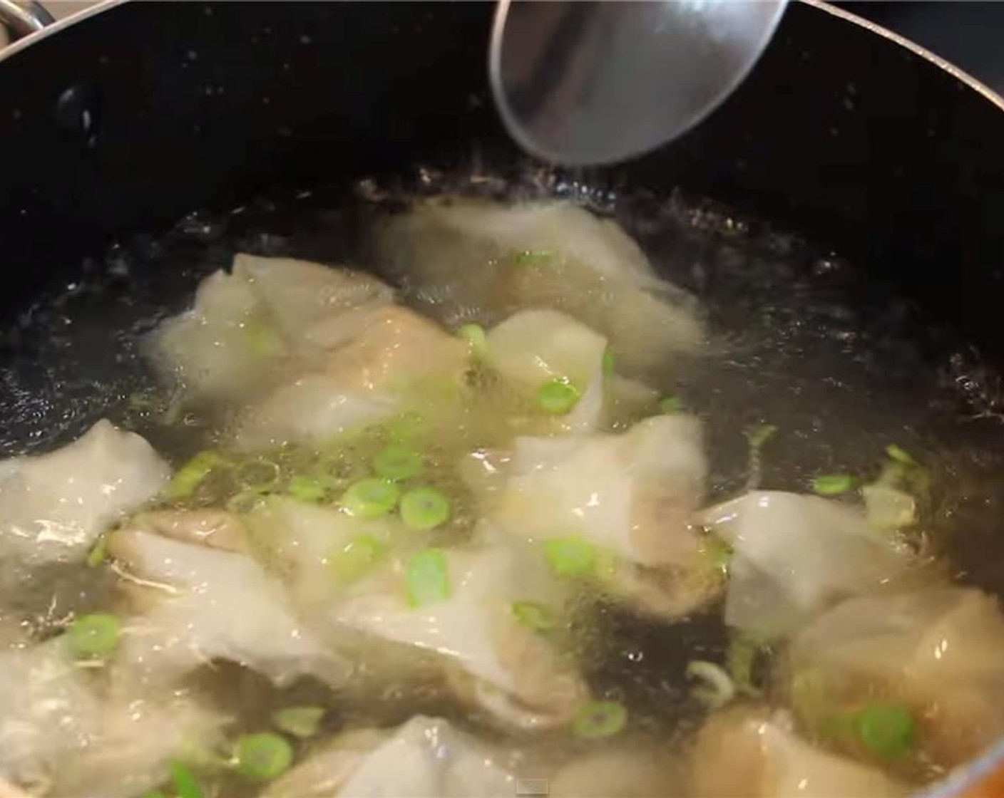 step 10 Once the water comes to a boil, add the wontons. Once the water starts boiling again, turn the heat to medium-low and cook for 4 minutes. Stir gently and occassionally.