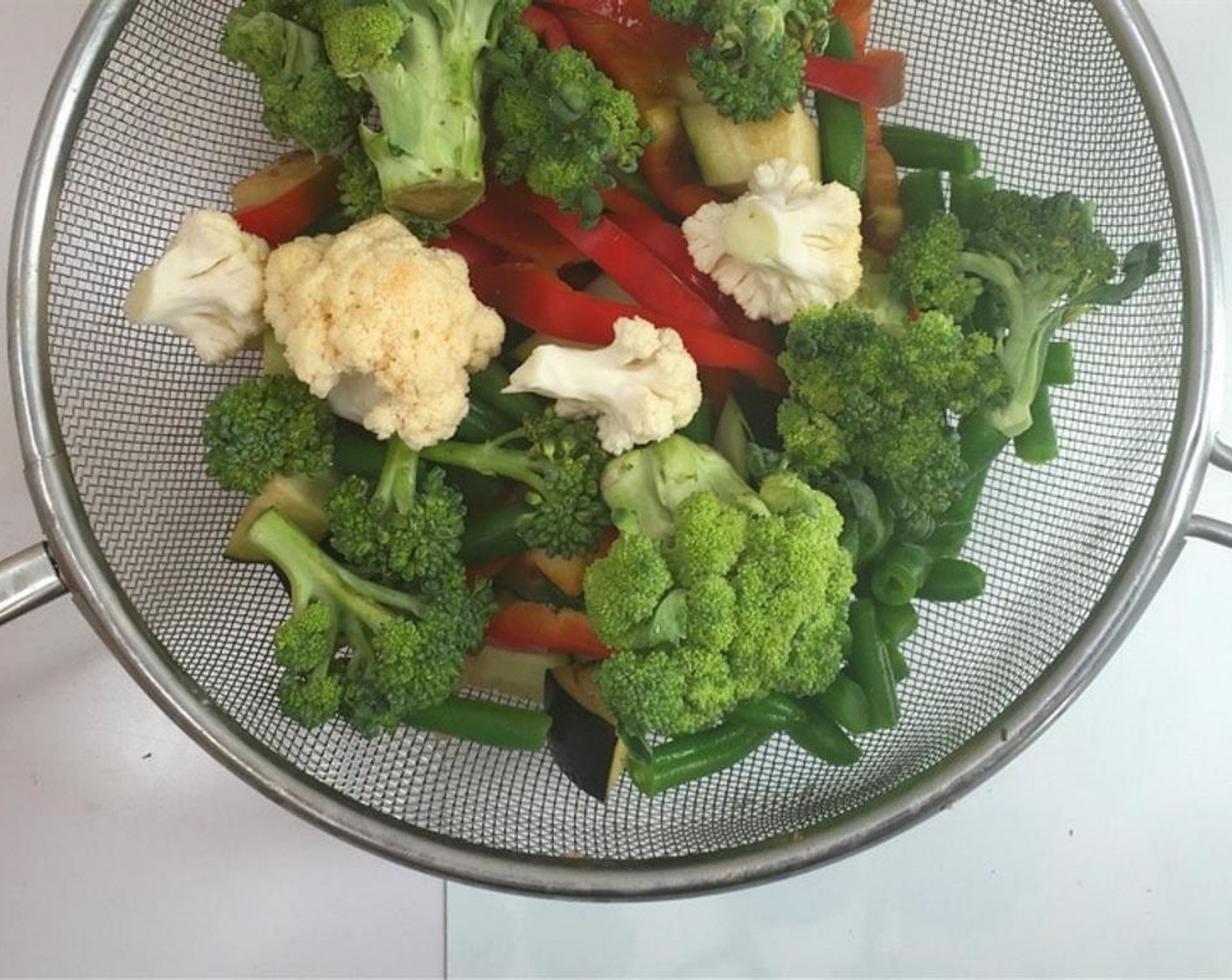 step 1 Peel the Maris Piper Potato (2/3 cup) and dice them up. Chop the Broccoli (1 cup), Cauliflower (3/4 cup), Brussels Sprouts (6), Zucchini (2/3 cup), Red Bell Pepper (1/2), Eggplant (1/2), and Green Beans (1 handful) into bite-size bits and rinse them all well under cold running tap water. Let the vegetables drain.