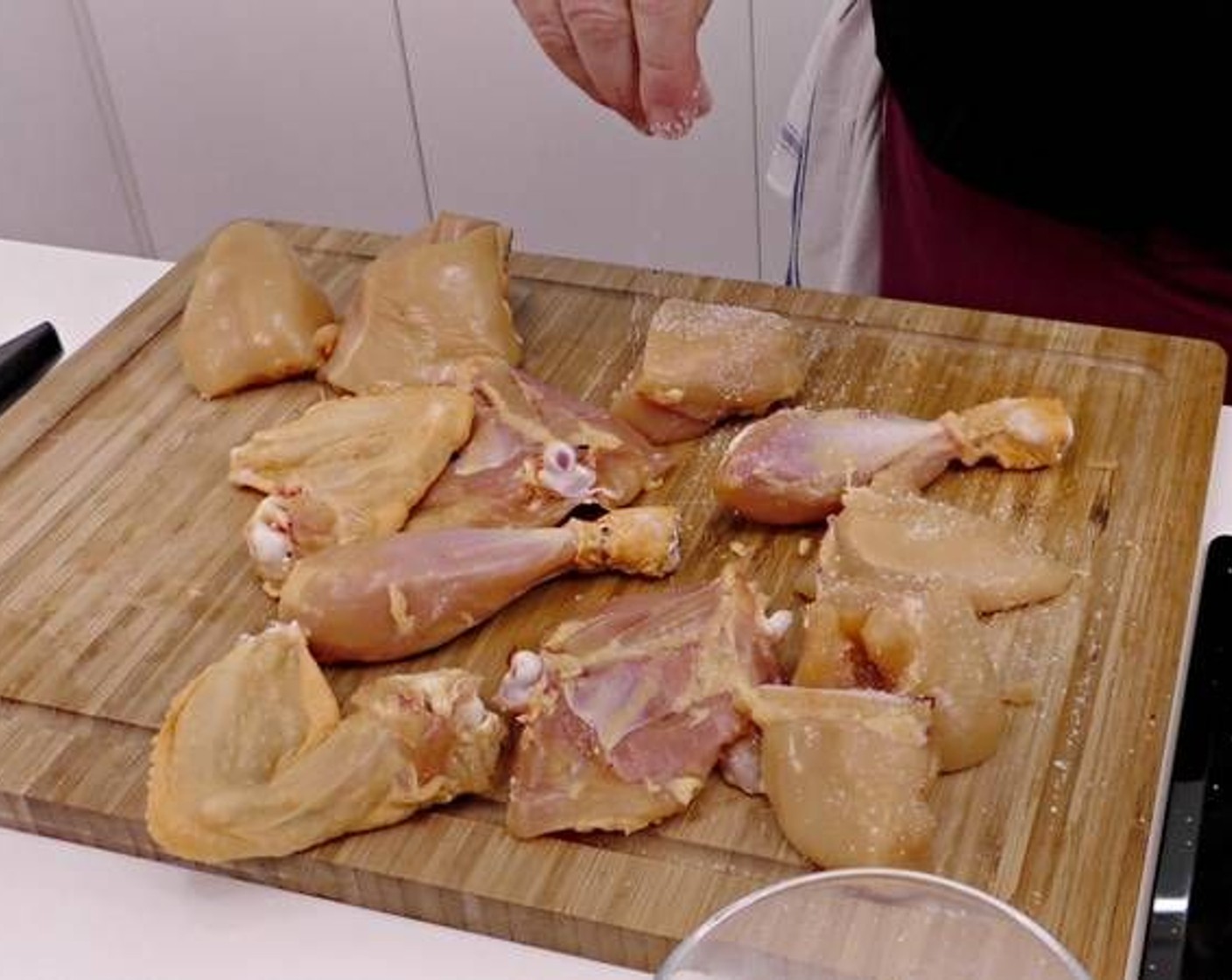 step 2 While the garlic slowly starts frying, start cutting up the Whole Chicken (1). Remove the skin and season with Salt (to taste).