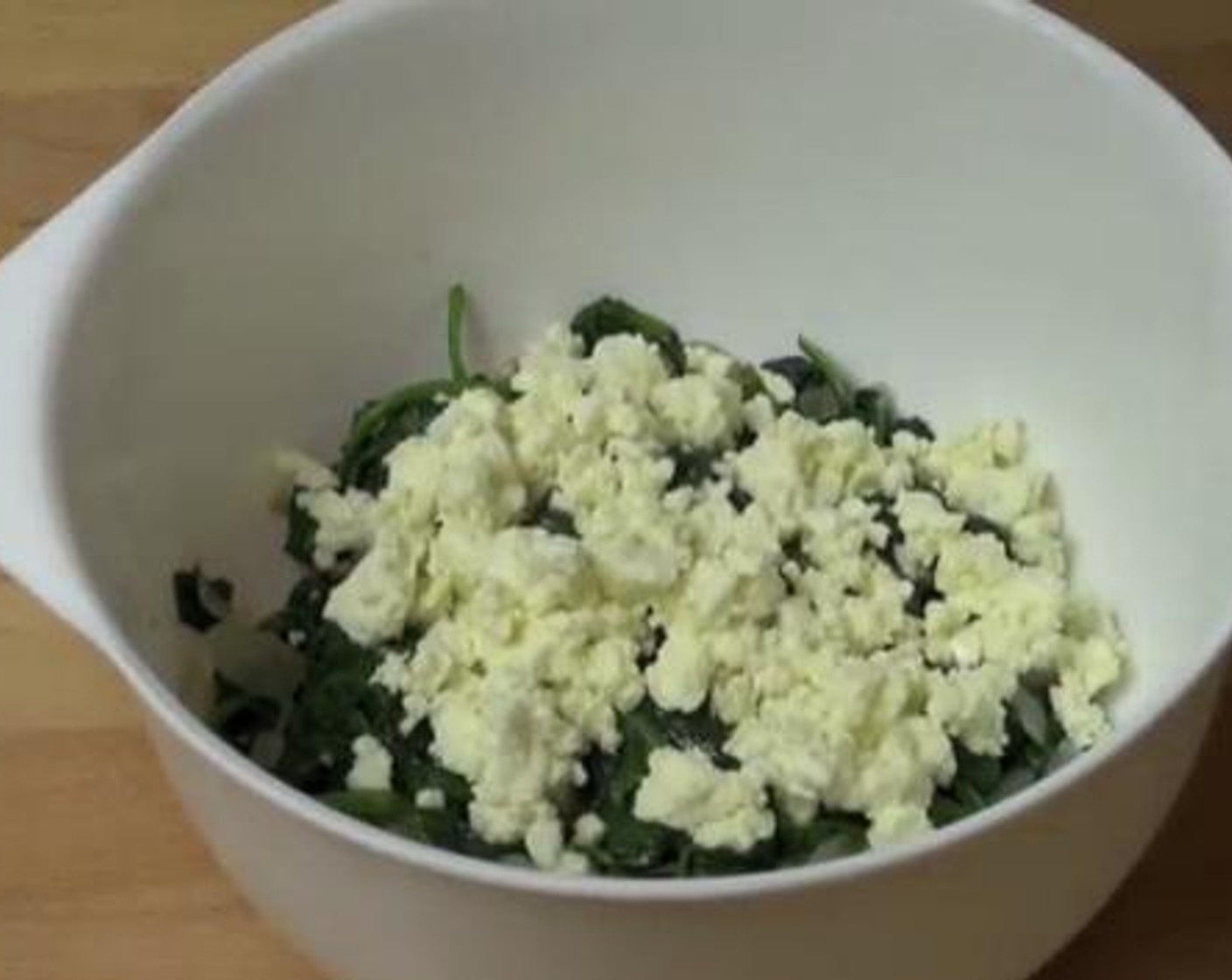 step 3 Transfer the spinach into a mixing bowl, and to that add the Feta Cheese (2/3 cup), juice from Lemon (1), Salt (to taste), and Ground Black Pepper (to taste). Mix everything well. Set aside while you work on the pastry.