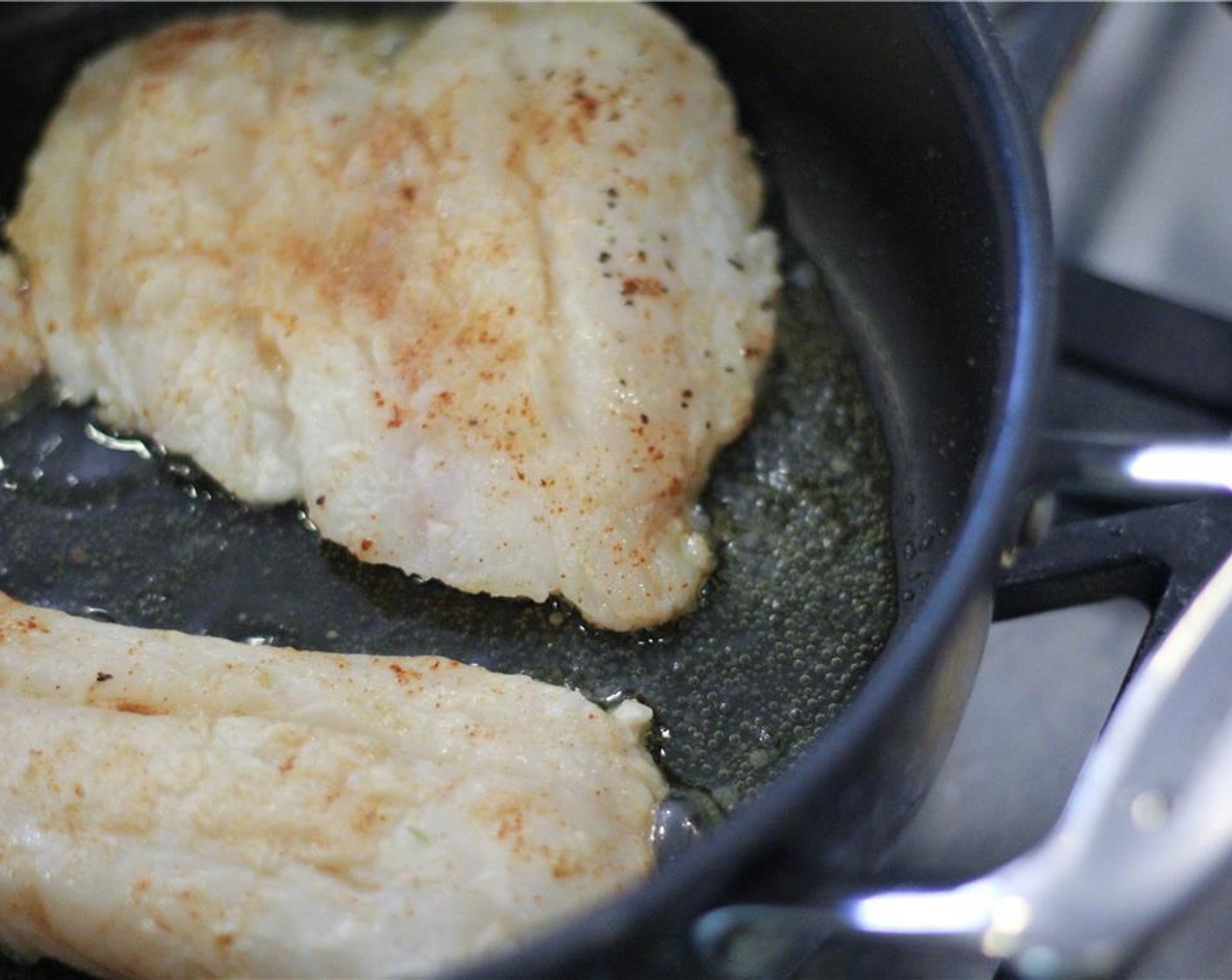step 7 In a large skillet, heat olive oil (1 Tbsp) over medium heat. Add fish and cook until outer edges are golden and fish flakes easily, about 5-6 minutes on each side.