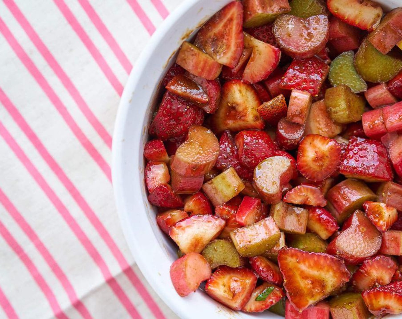 step 2 In a large bowl, combine Fresh Strawberries (2 cups), Rhubarb (2 cups), Coconut Sugar (1/4 cup), and Ground Cinnamon (1 tsp).