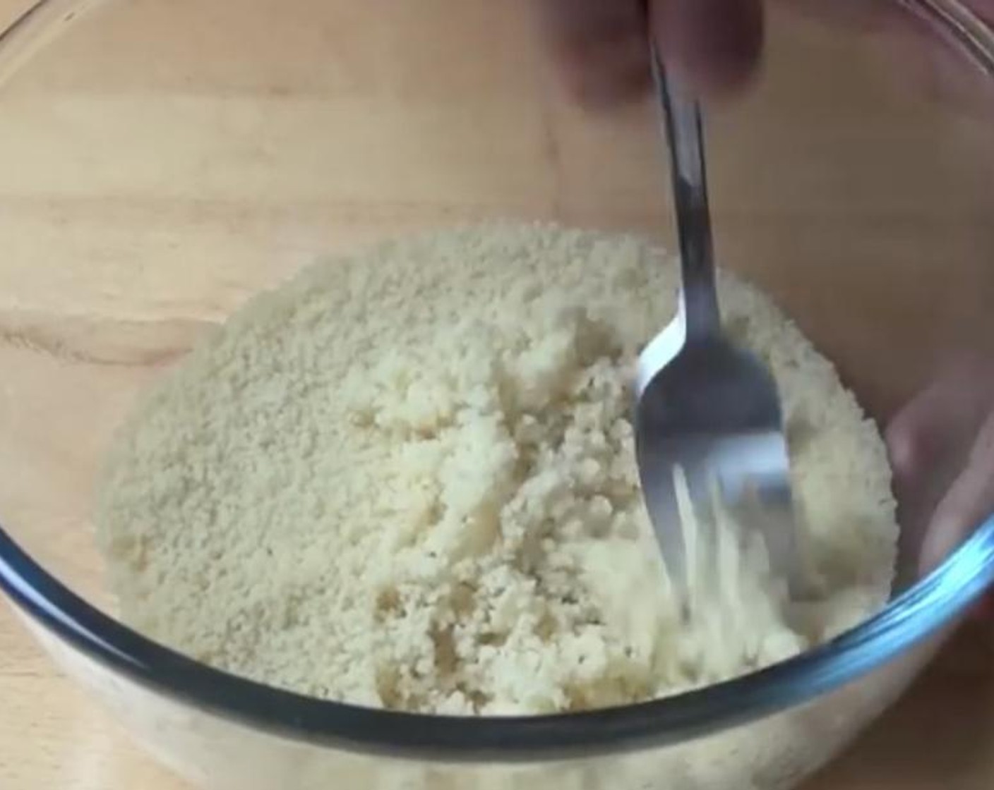 step 3 Use a fork to fluff up the couscous and separate the grains. Then season with Salt (to taste) and Ground Black Pepper (to taste).