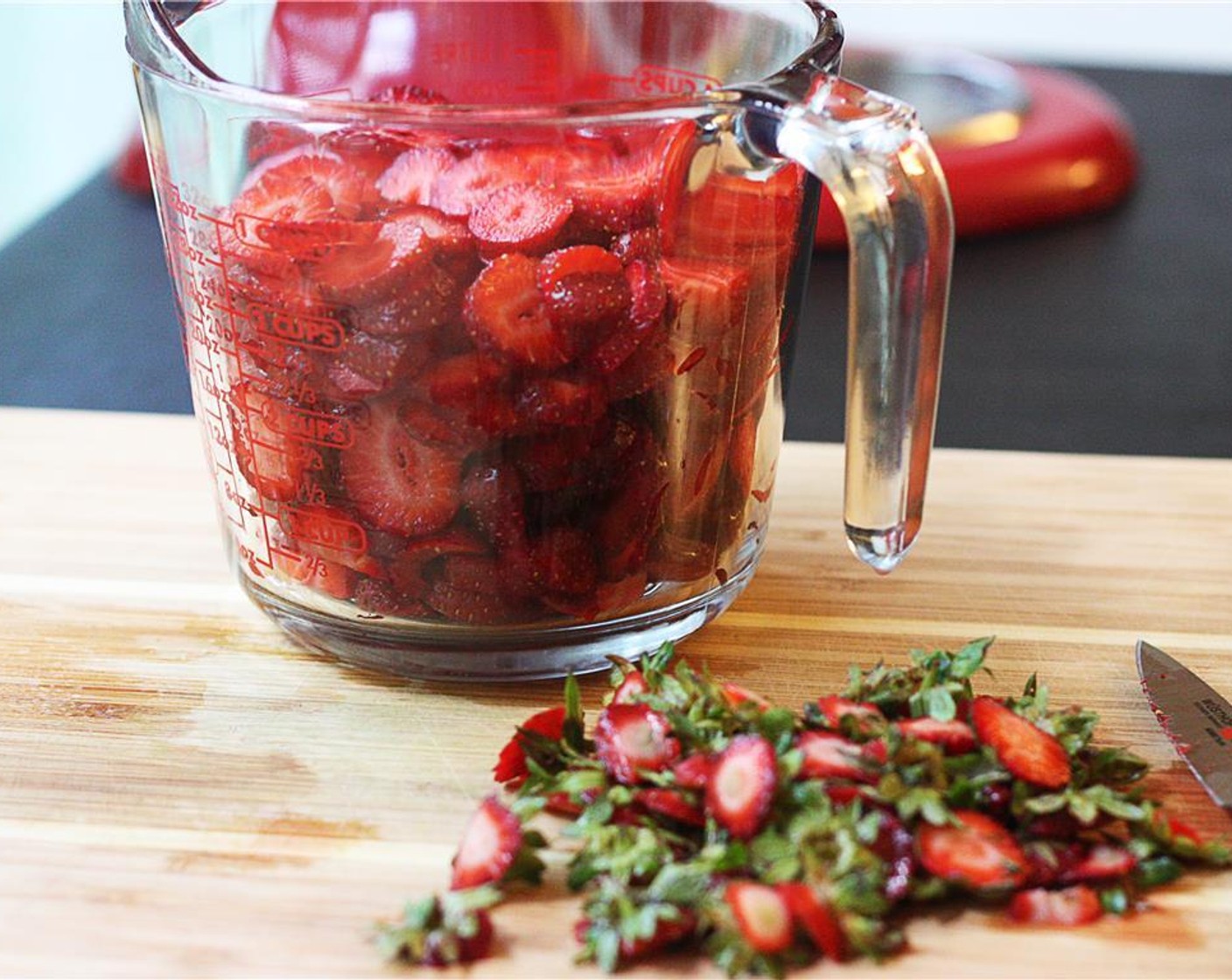 step 8 While the cake cools, wash Fresh Strawberries (3 cups) and allow to dry slightly in a colander. Trim off the greens and slice the strawberries into a bowl and set aside.