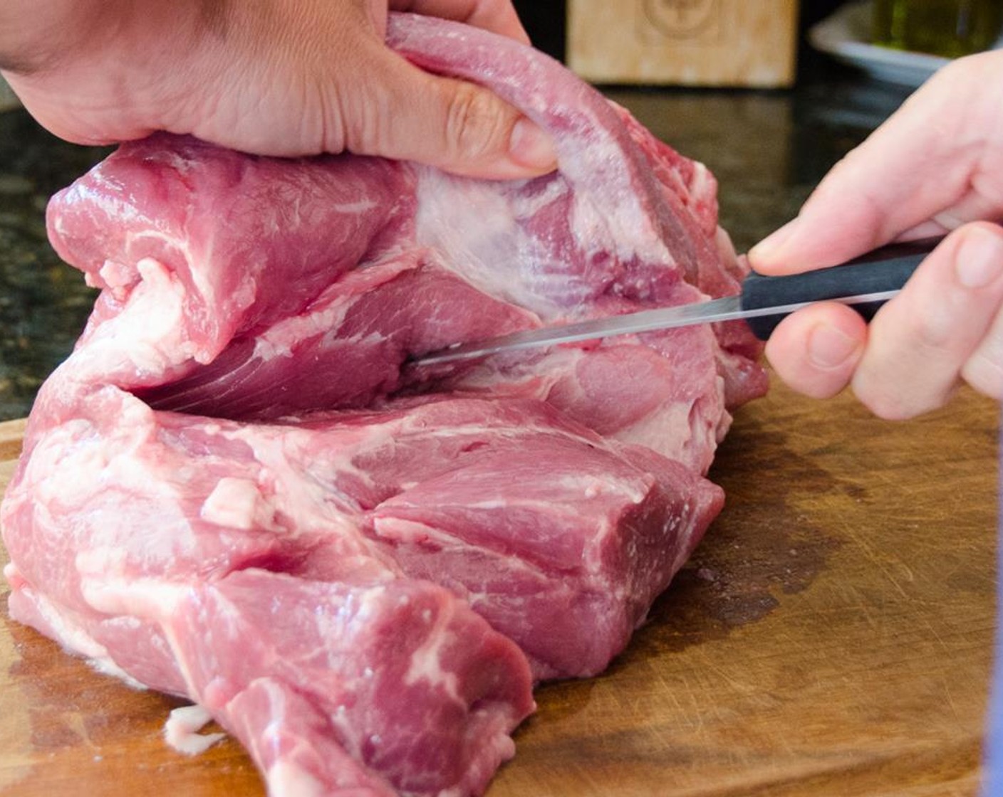 step 1 The night before, butterfly the Boneless Pork Shoulder (6 lb) by cutting the meat open so that it lays in a flat even thickness. Cut through the thick part of the meat, horizontally to almost the edge. Unfold it for a broad flap of meat, about 1 1/2-2 inches thick.