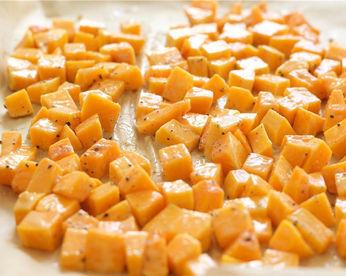 step 4 Peel and cube the Butternut Squash (1) into half-inch pieces. Toss the pieces with half of the miso-butter sauce. Place on a pan lined with parchment a roast squash for 20 minutes.