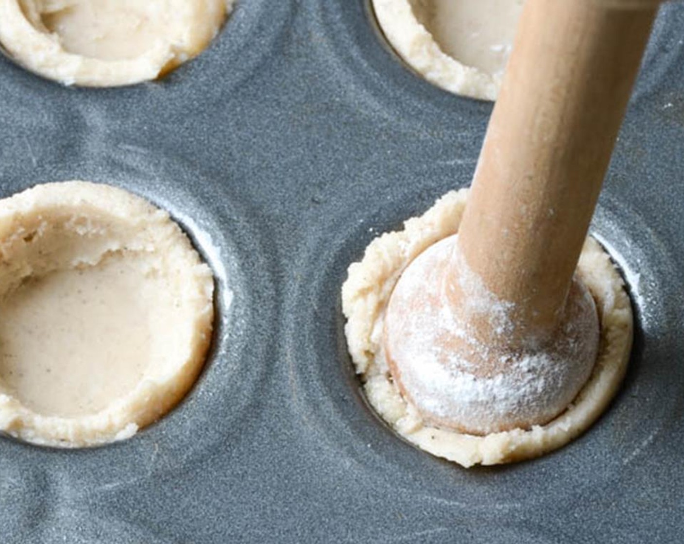 step 8 Bake for 10 minutes remove from oven and use your dough tamper again, to press the puffed dough down into the shell.