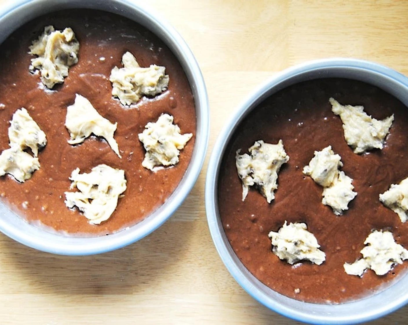 step 11 1 heaping tablespoon at a time, add globs of the in-cake cookie dough to the cake batter. Try to spread them out as evenly as possible.