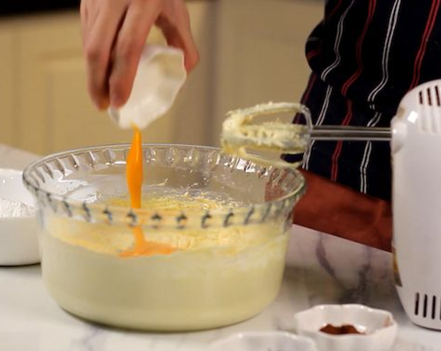 step 3 Combine yolks of the Eggs (2) into the mixture.