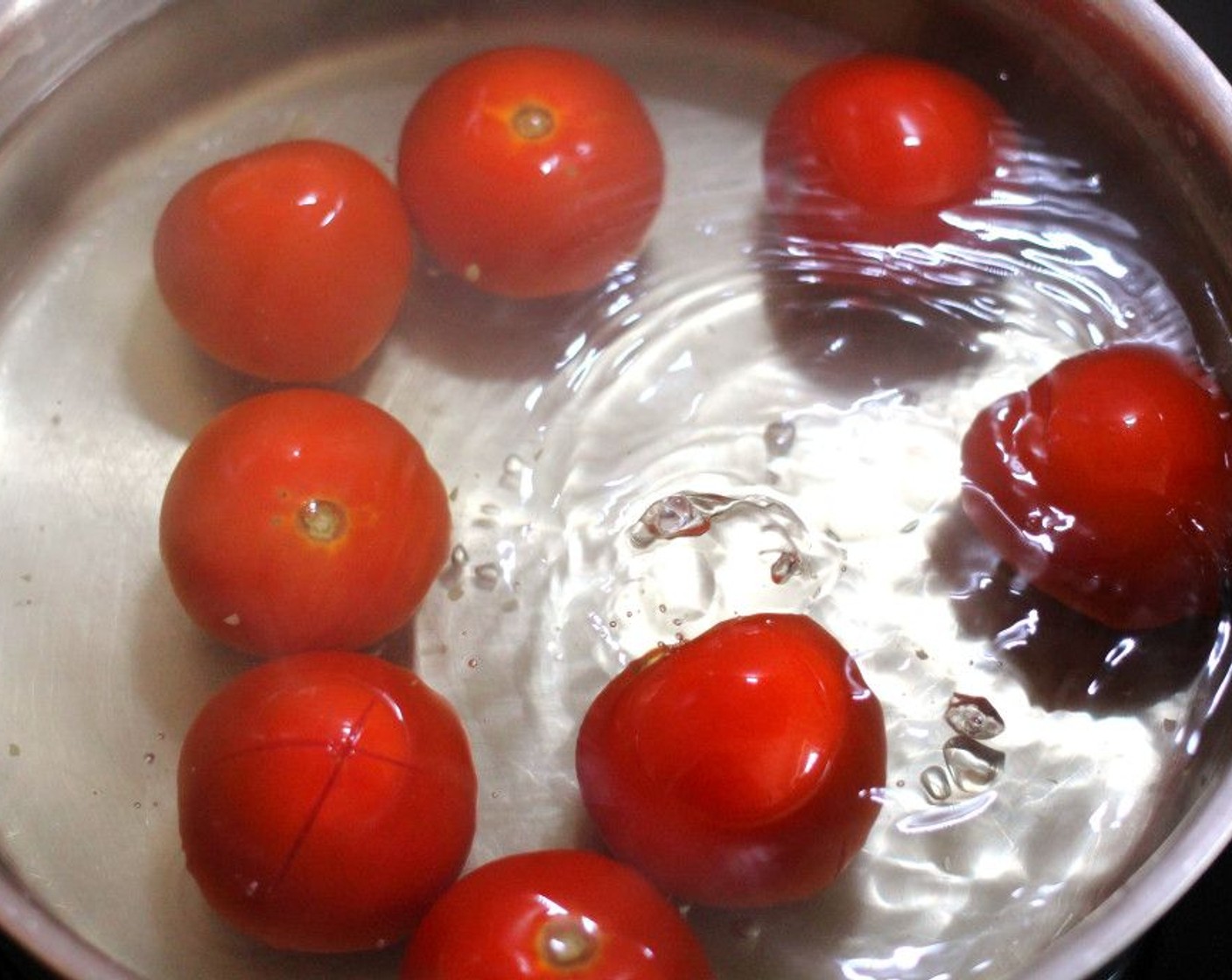 step 2 Blanch the tomatoes in boiling water with a generous pinch of Kosher Salt (to taste) water for 30 seconds.