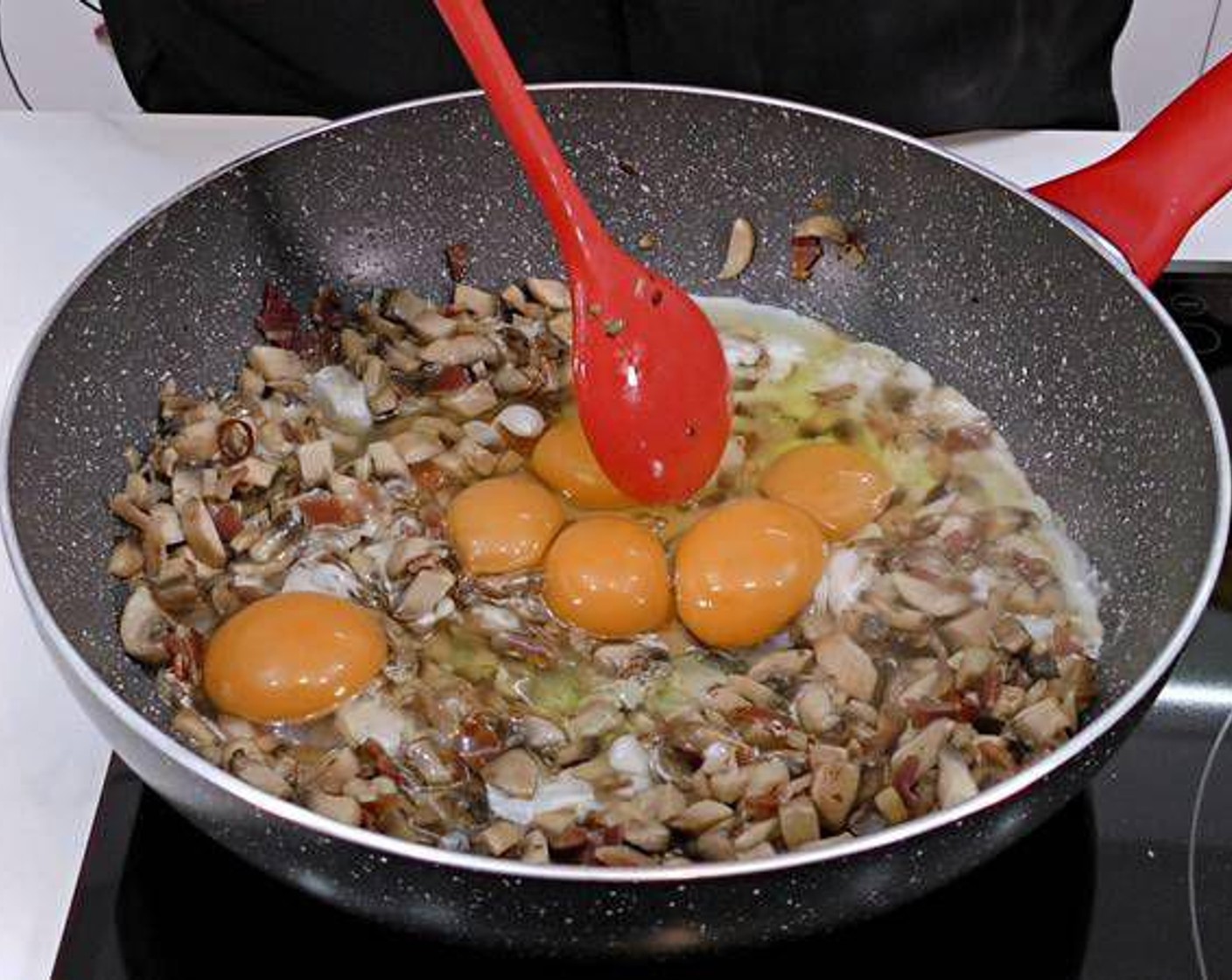 step 3 Next crack and add the Eggs (6) being careful not to break the yolks. Let the egg whites cook first.