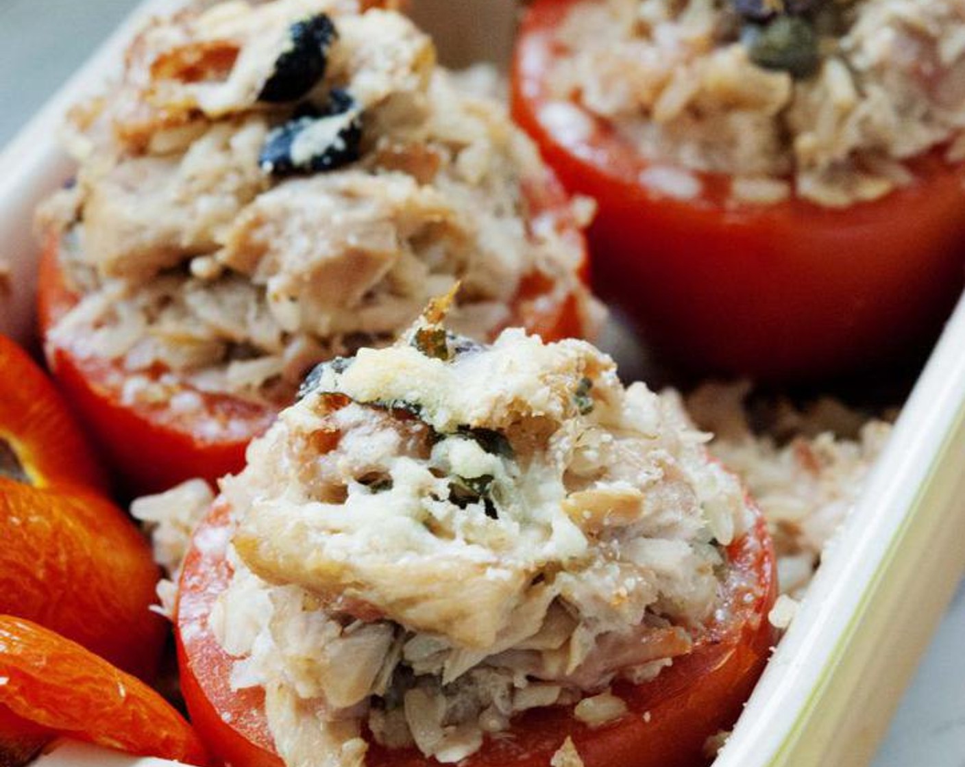 step 4 Fill up the tomatoes with the rice mixture, sprinkle the top with Parmesan Cheese (1 Tbsp). Place the tomato hat on top, drizzle Extra-Virgin Olive Oil (1 Tbsp) and bake for 20 to 30 minutes or until the top starts to get crispy.