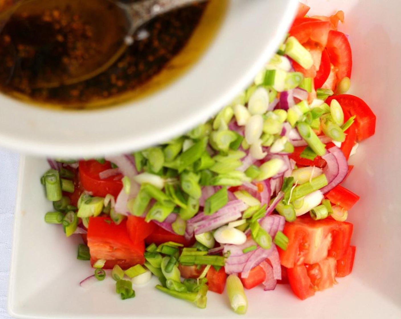 step 2 Mix dressing with Tomatoes (to taste), Red Onions (to taste), Scallions (to taste), Gorgonzola Cheese (to taste), Anchovies (to taste), and Fresh Basil (to taste).