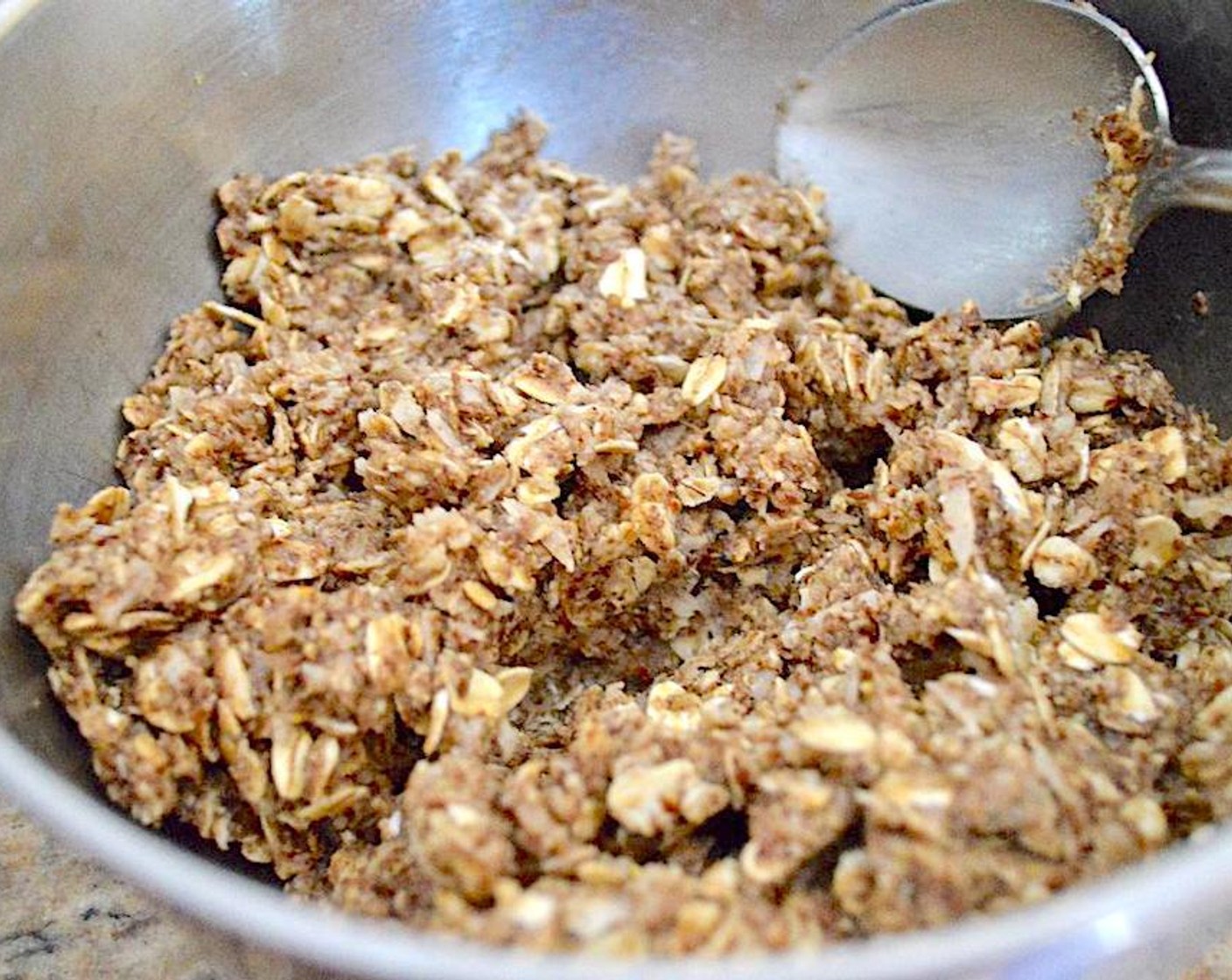 step 1 Stir Old Fashioned Rolled Oats (1 cup), Almond Butter (2/3 cup), Unsweetened Coconut Flakes (1/2 cup), Flaxseeds (1/2 cup), Honey (2 Tbsp), Ground Ginger (1/4 tsp), and Ground Nutmeg (1/4 tsp) thoroughly in a large bowl. Put the mixture in the refrigerator for 30 minutes to firm up enough to roll.
